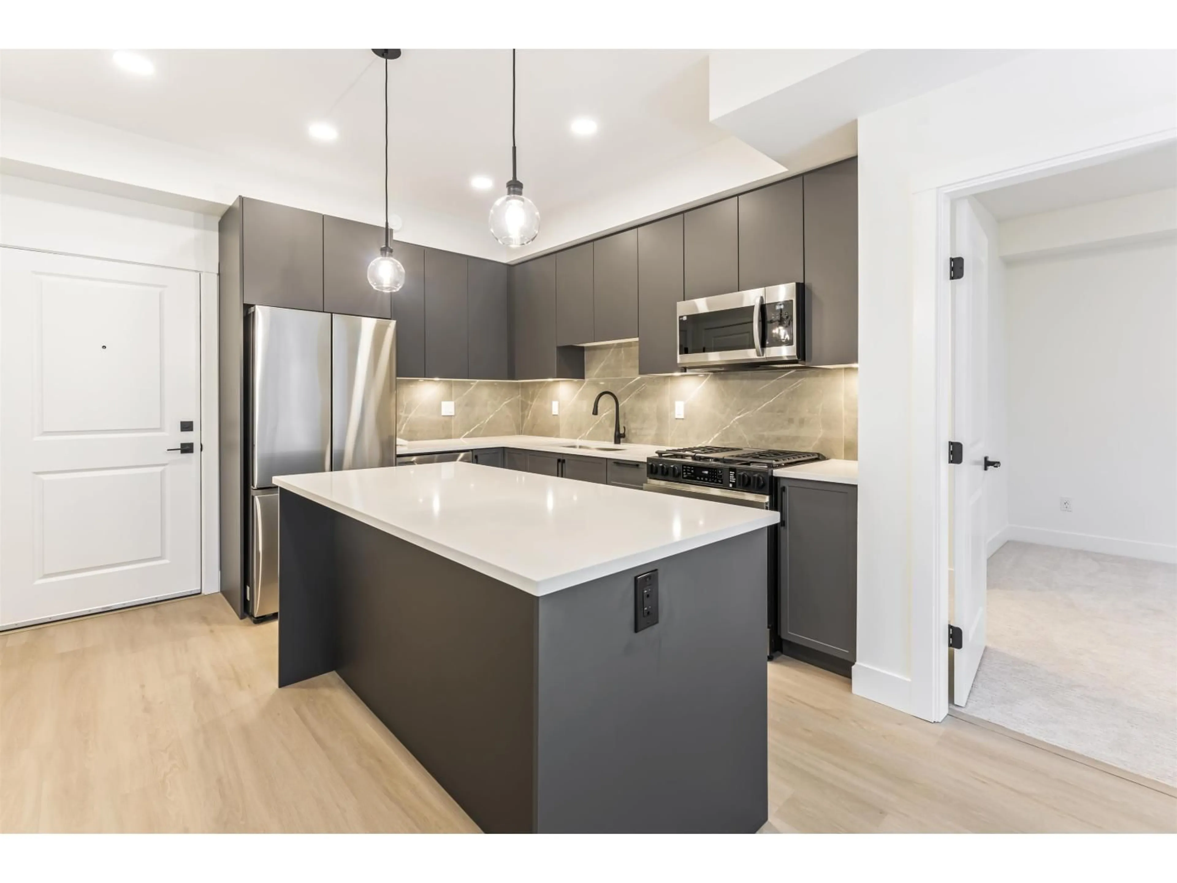 Open concept kitchen, unknown for 611 - 3480 146A STREET, Surrey British Columbia V4P0H6