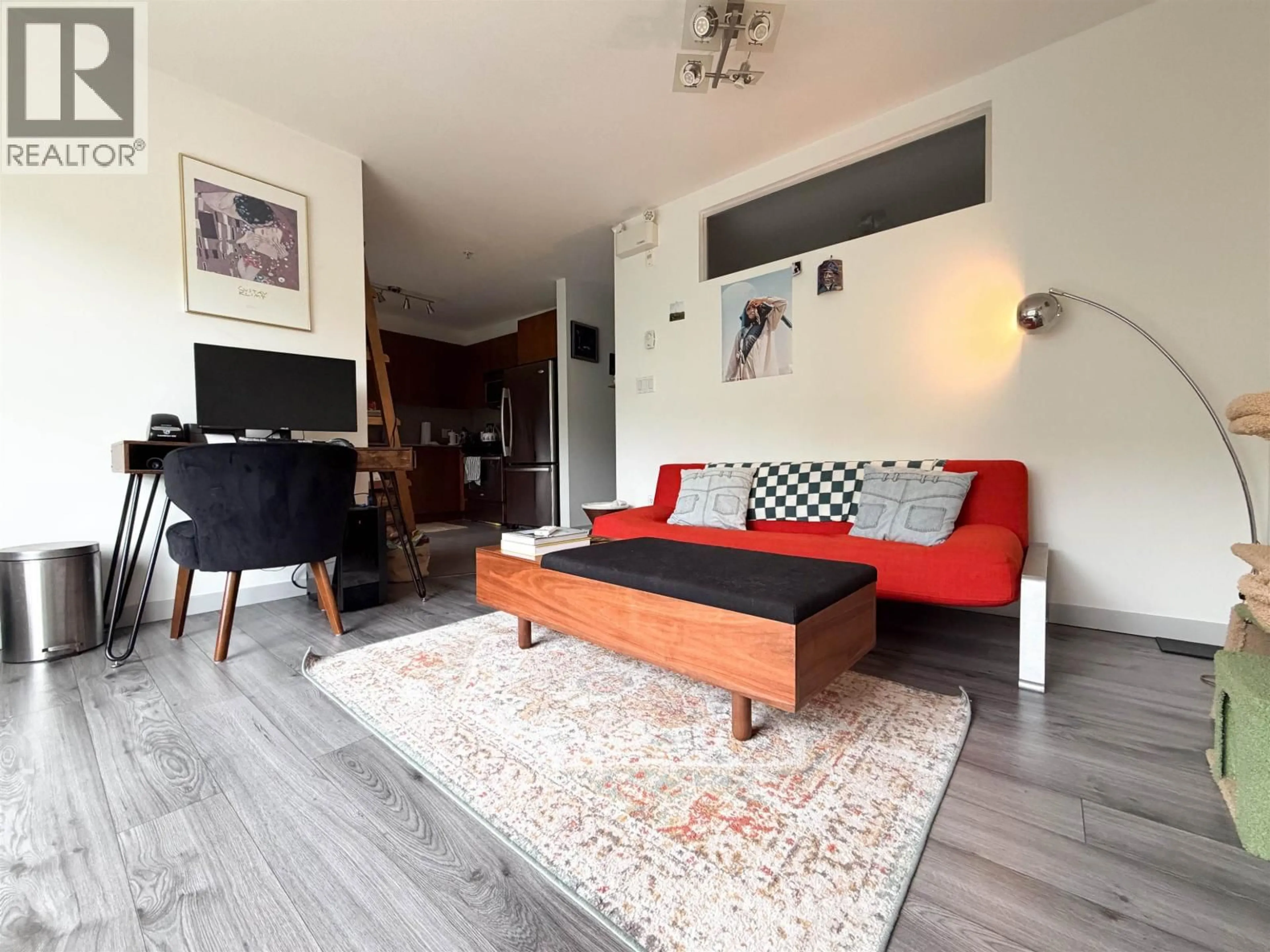 Living room with furniture, wood/laminate floor for 312 - 5775 IRMIN STREET, Burnaby British Columbia V5J0C3