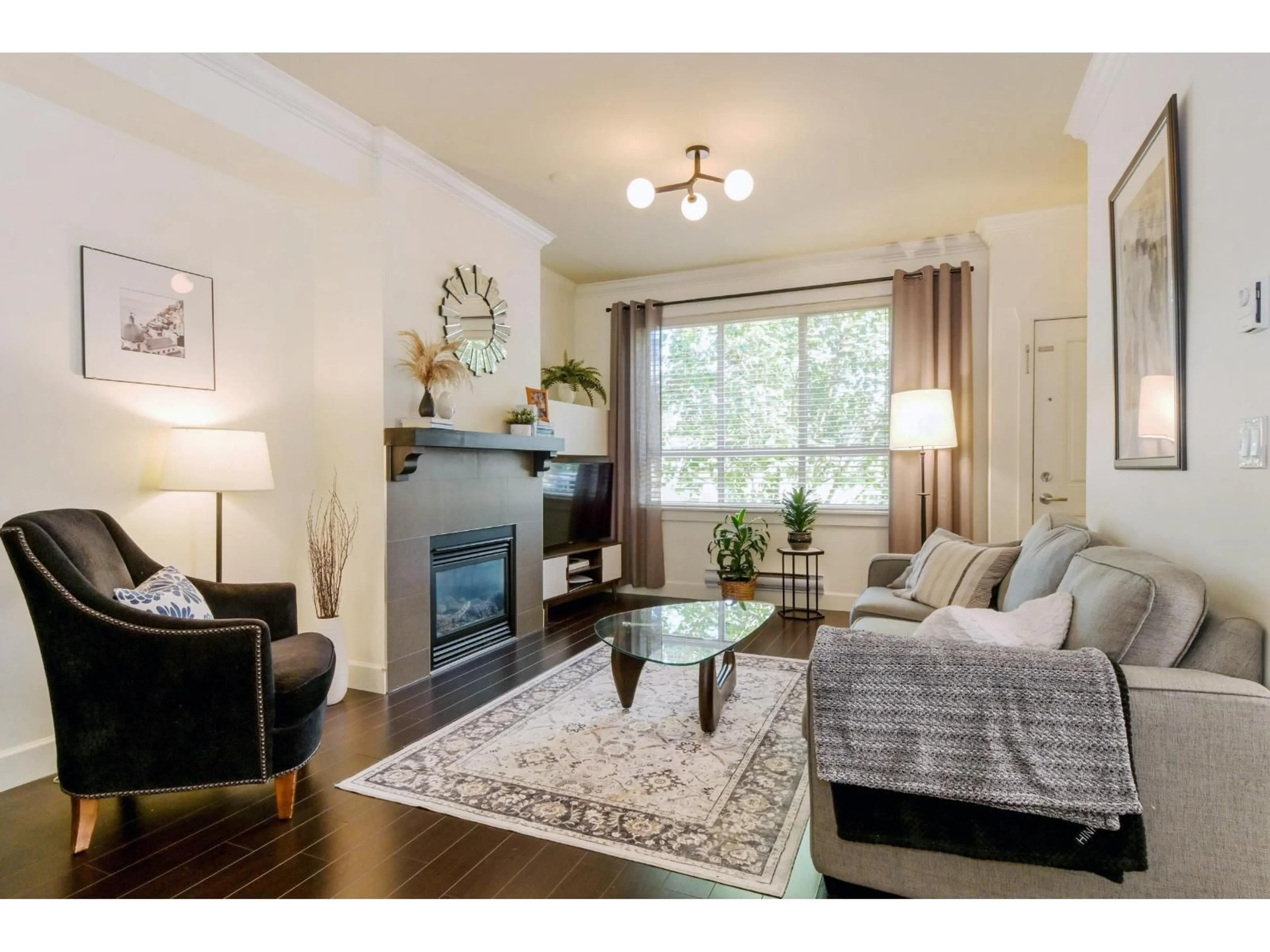 Living room with furniture, wood/laminate floor for 7 - 19560 68 AVENUE, Surrey British Columbia V4N5Y5
