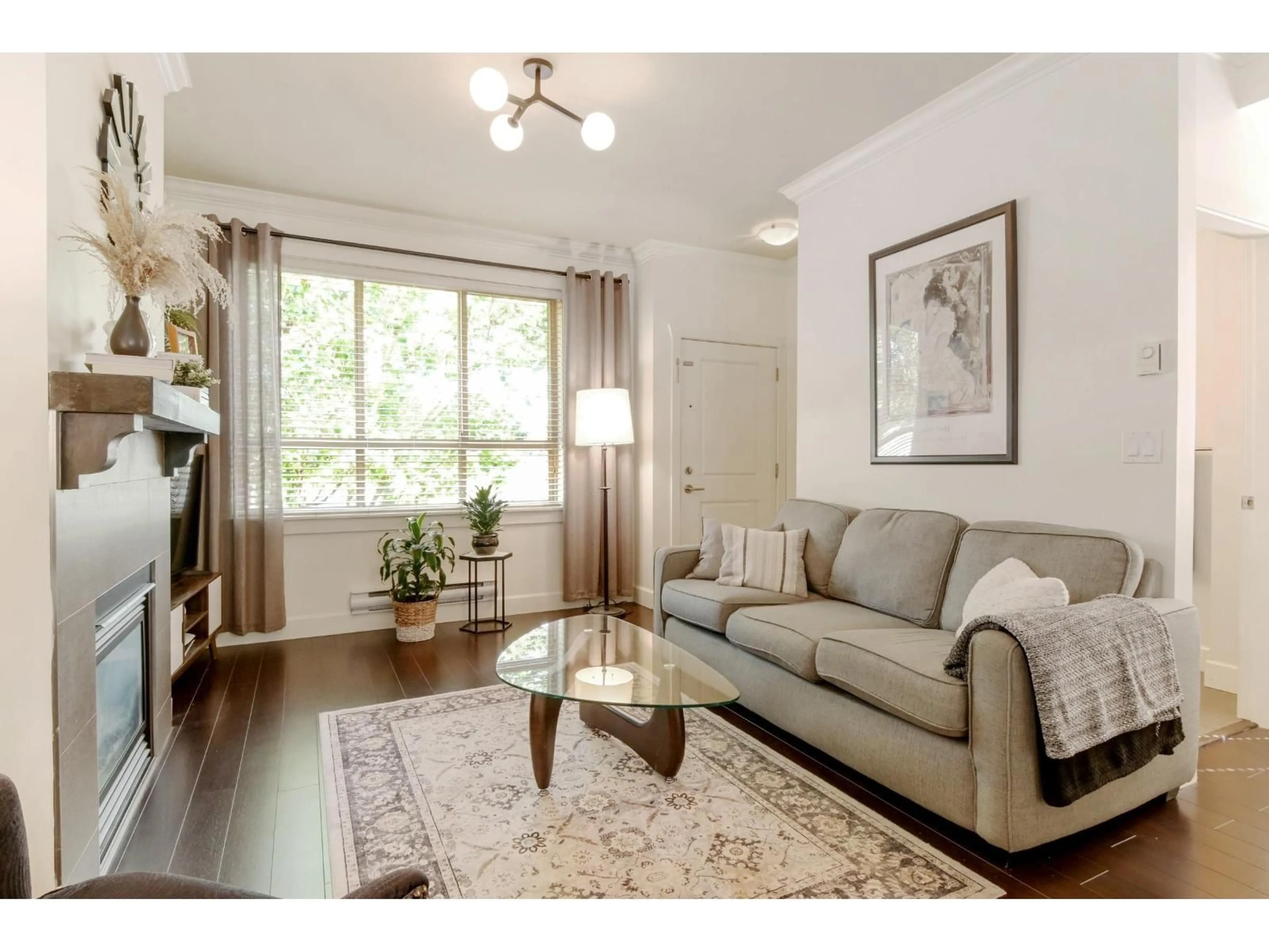 Living room with furniture, wood/laminate floor for 7 - 19560 68 AVENUE, Surrey British Columbia V4N5Y5