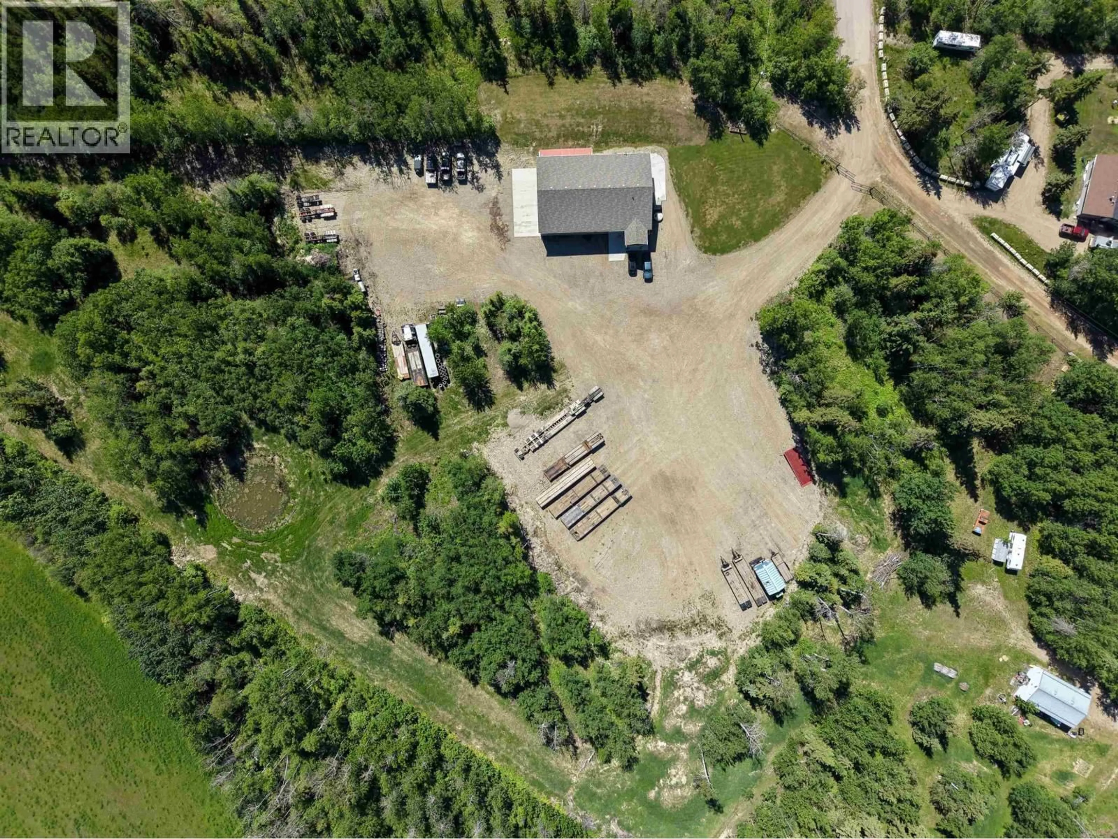 A pic from outside/outdoor area/front of a property/back of a property/a pic from drone, building for 13573 BLUEBIRD ROAD, Fort St. John British Columbia V1J4M7