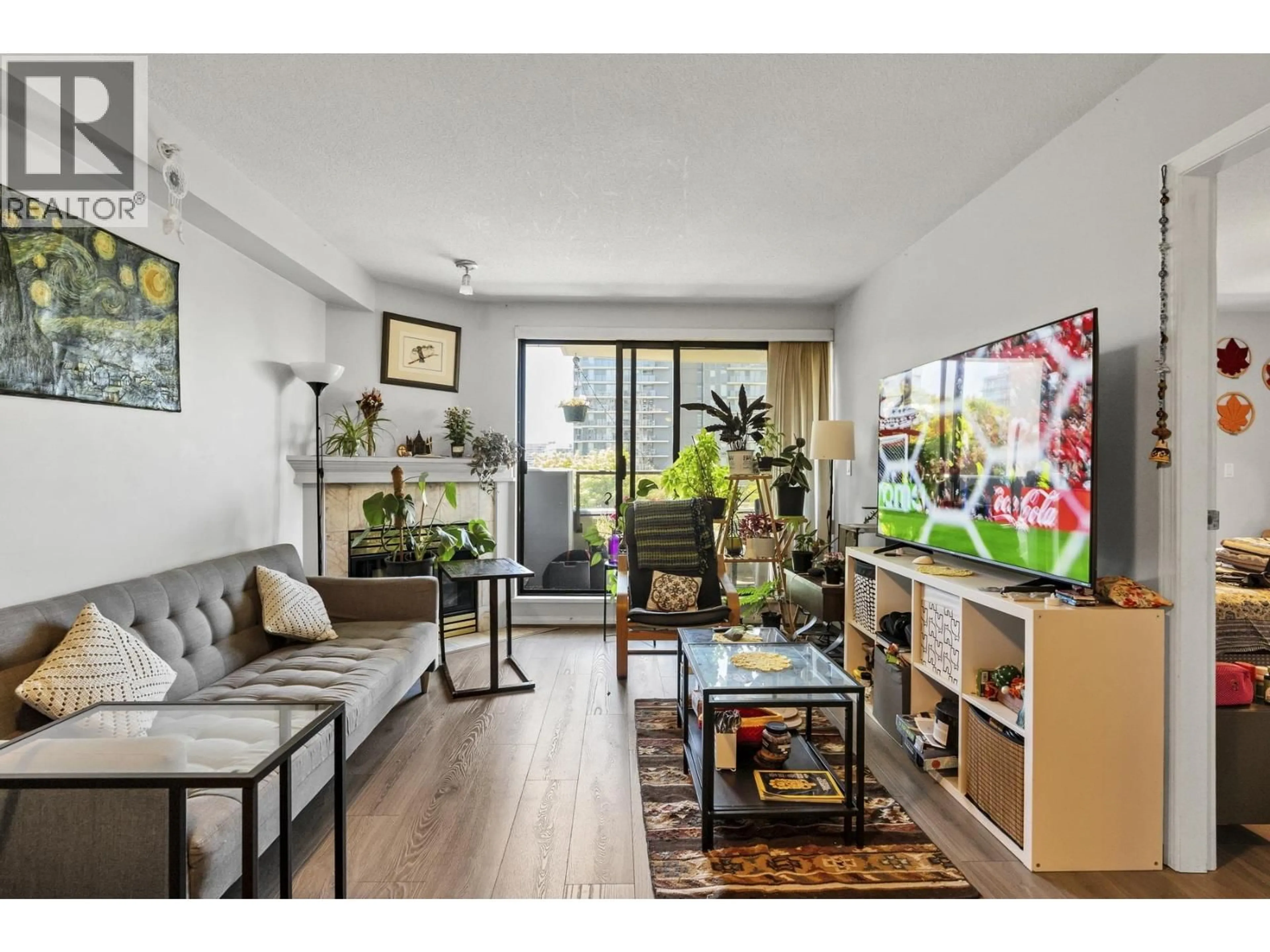 Living room with furniture, wood/laminate floor for 602 - 6611 COONEY ROAD, Richmond British Columbia V6Y4C5