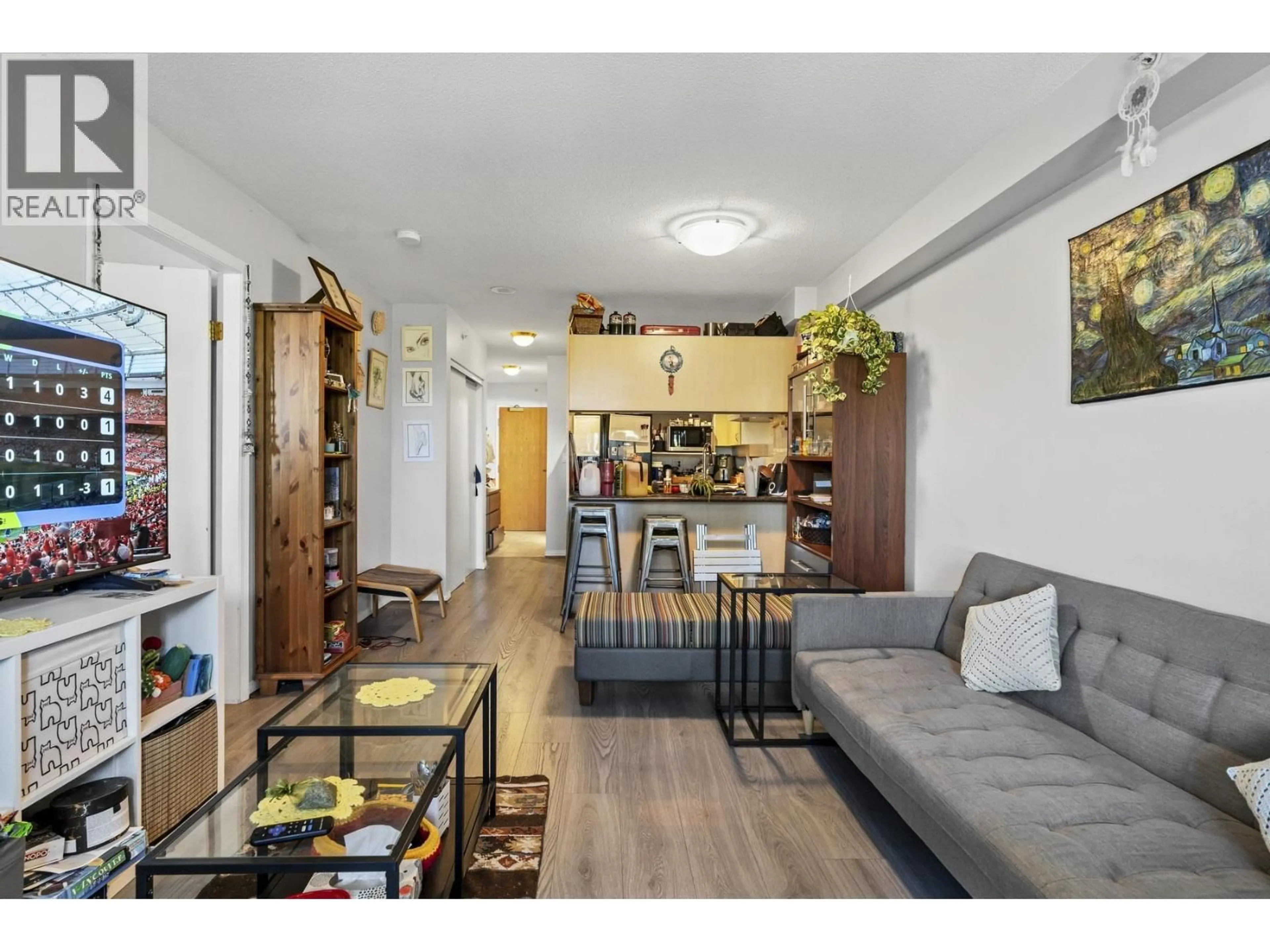 Living room with furniture, wood/laminate floor for 602 - 6611 COONEY ROAD, Richmond British Columbia V6Y4C5