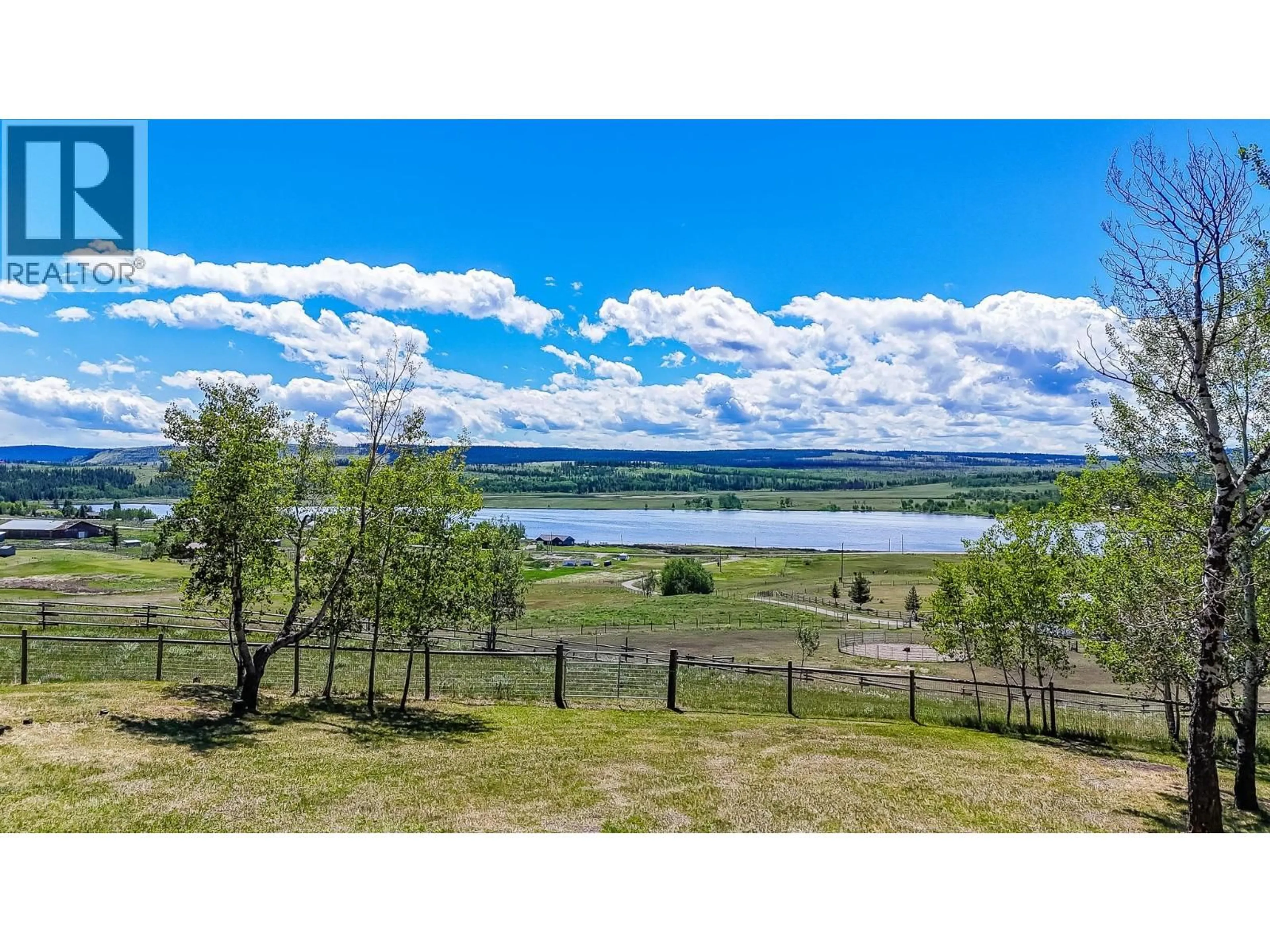 A pic from outside/outdoor area/front of a property/back of a property/a pic from drone, water/lake/river/ocean view for 5080 KINNCUM ROAD, 108 Mile Ranch British Columbia V0K2Z0