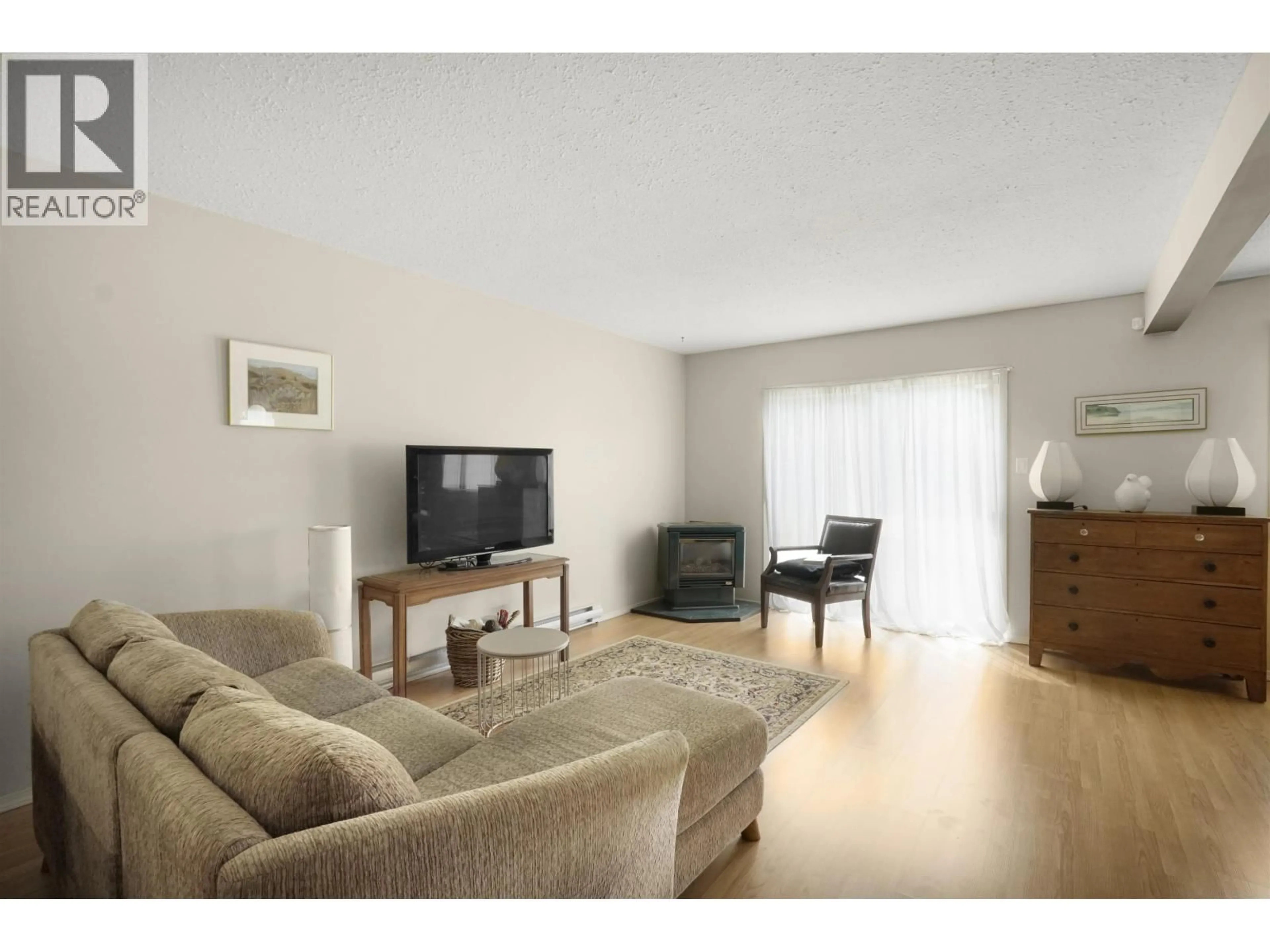 Living room with furniture, wood/laminate floor for 45 HALLMAN STREET, Kitimat British Columbia V8C2P9