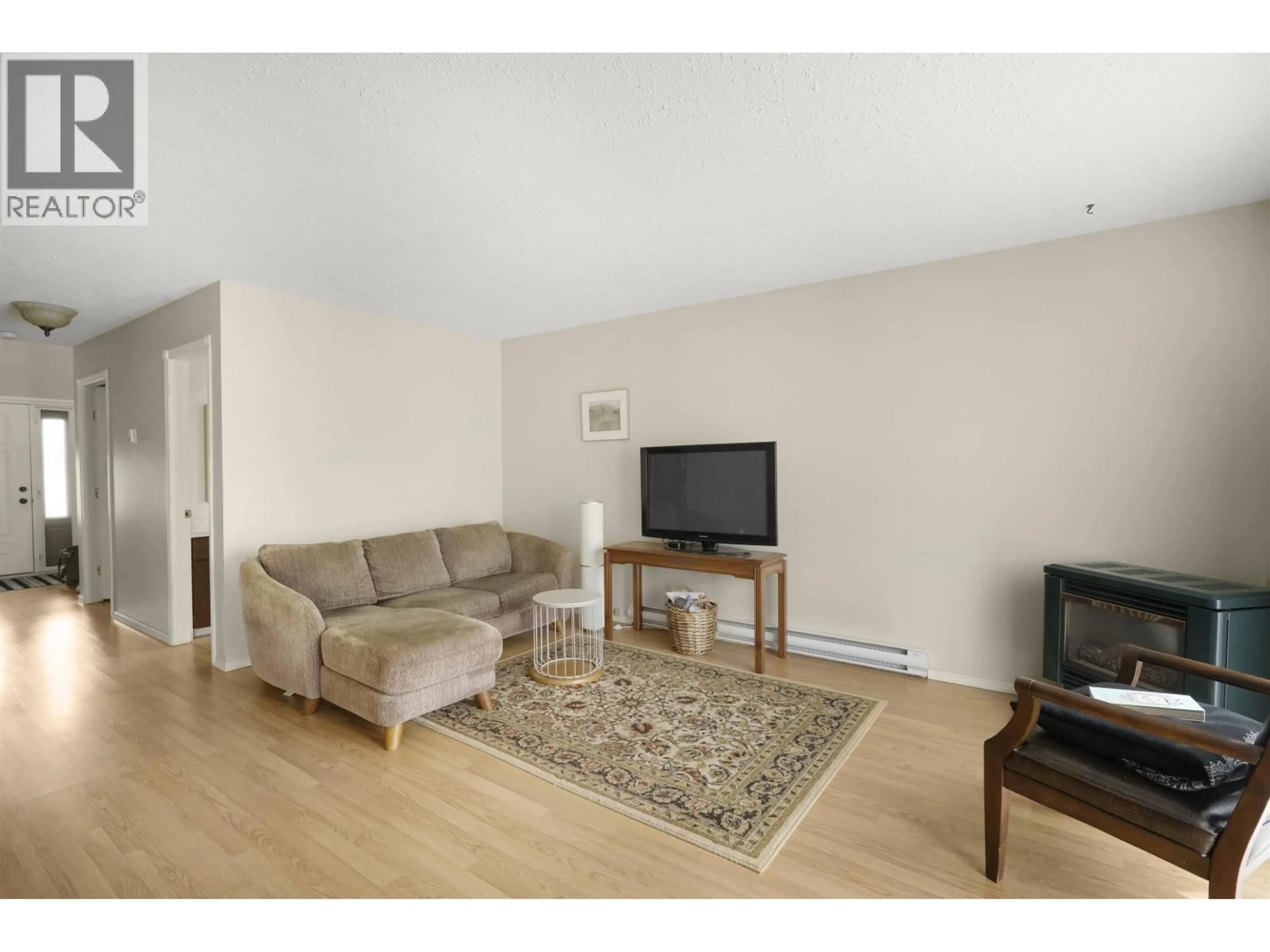 Living room with furniture, wood/laminate floor for 45 HALLMAN STREET, Kitimat British Columbia V8C2P9