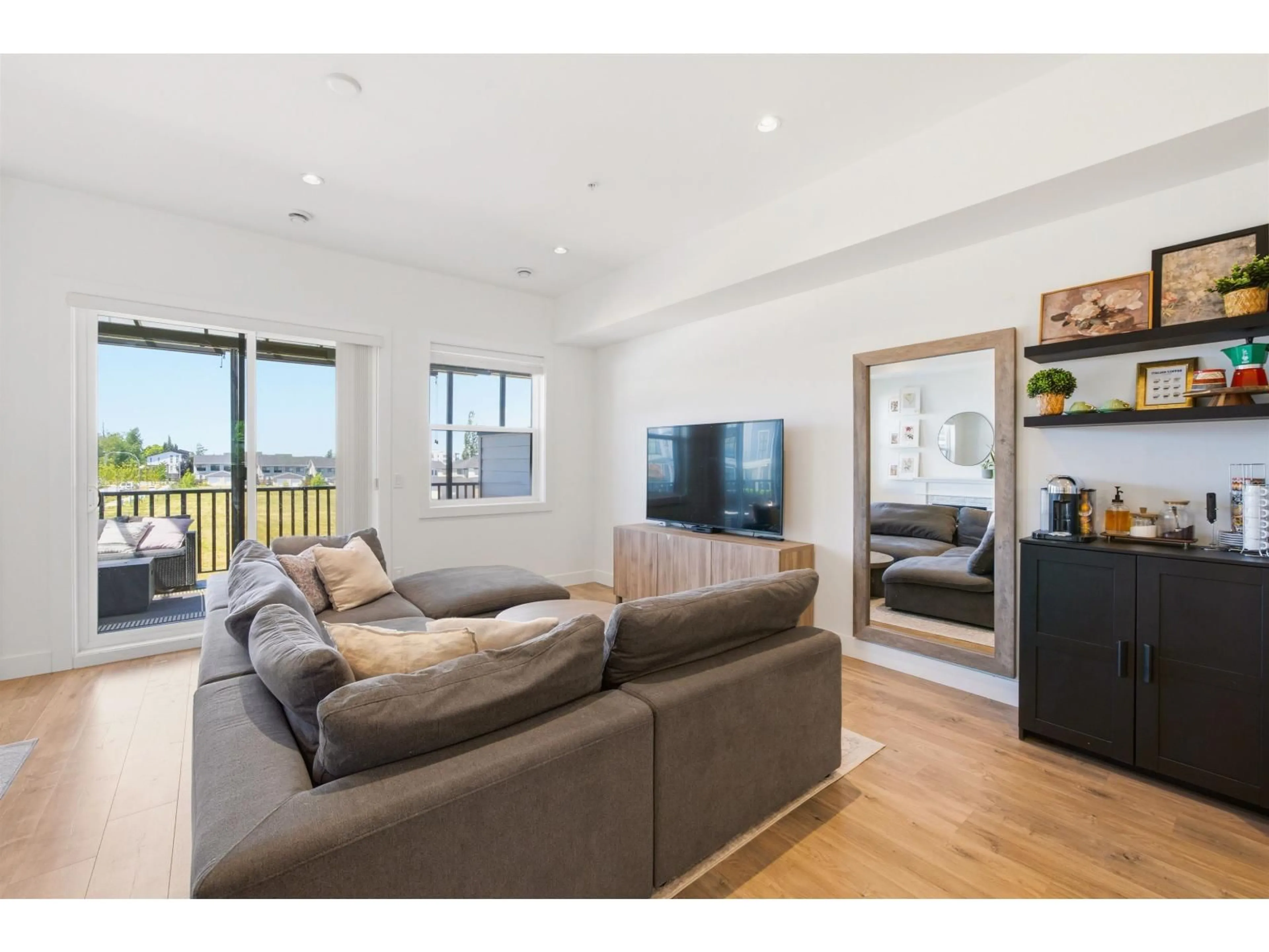 Living room with furniture, wood/laminate floor for 8157 202 STREET, Langley British Columbia V2Y3K2