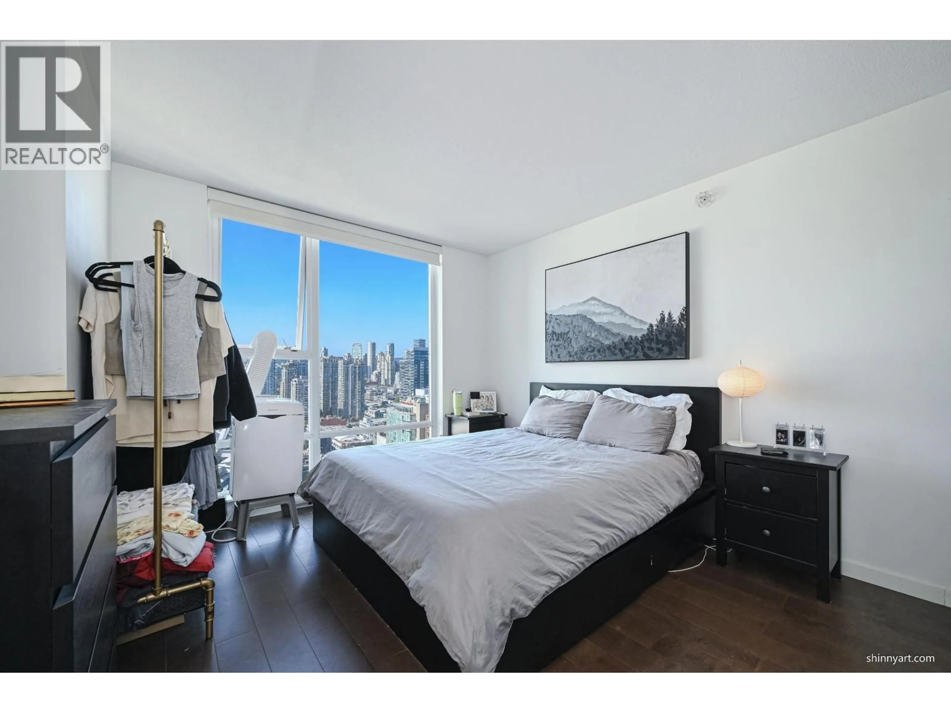 Bedroom with bed, wood/laminate floor for 2910 - 668 CITADEL PARADE, Vancouver British Columbia V6B1W6