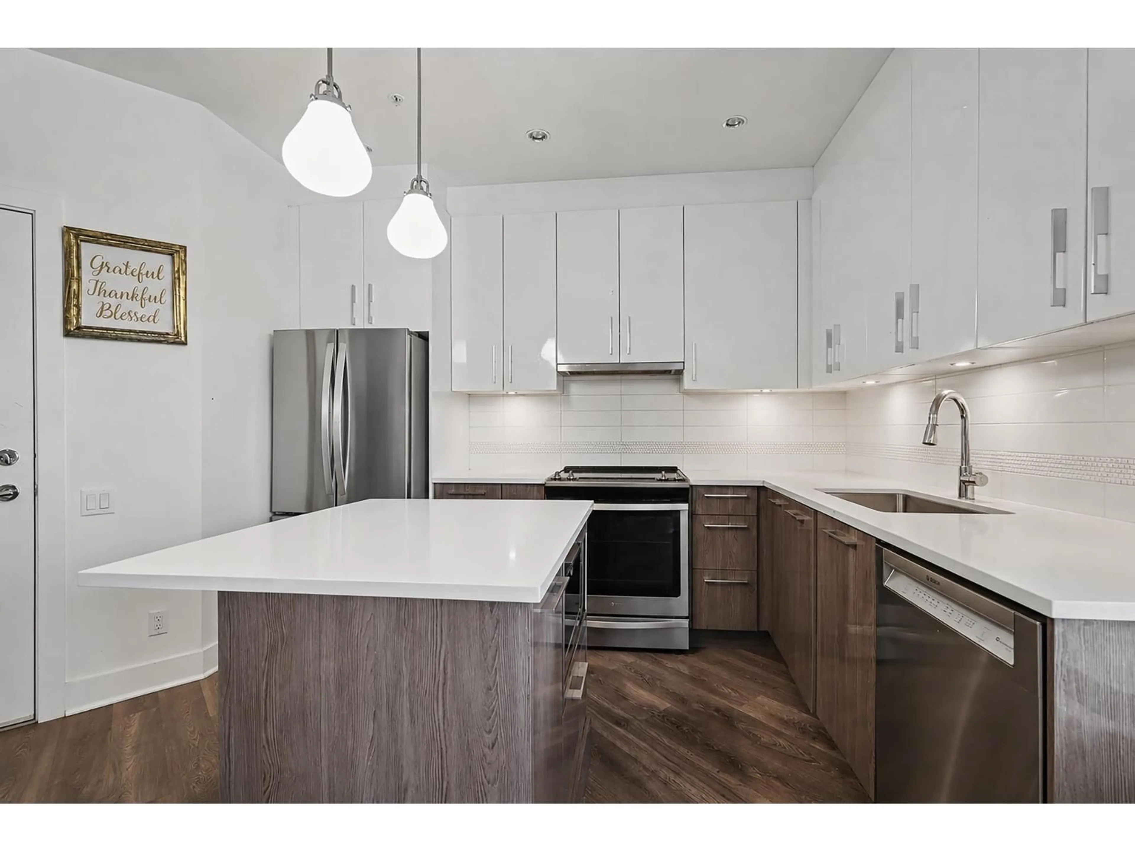 Open concept kitchen, wood/laminate floor for 301 - 20829 77A AVENUE, Langley British Columbia V2Y0Y5