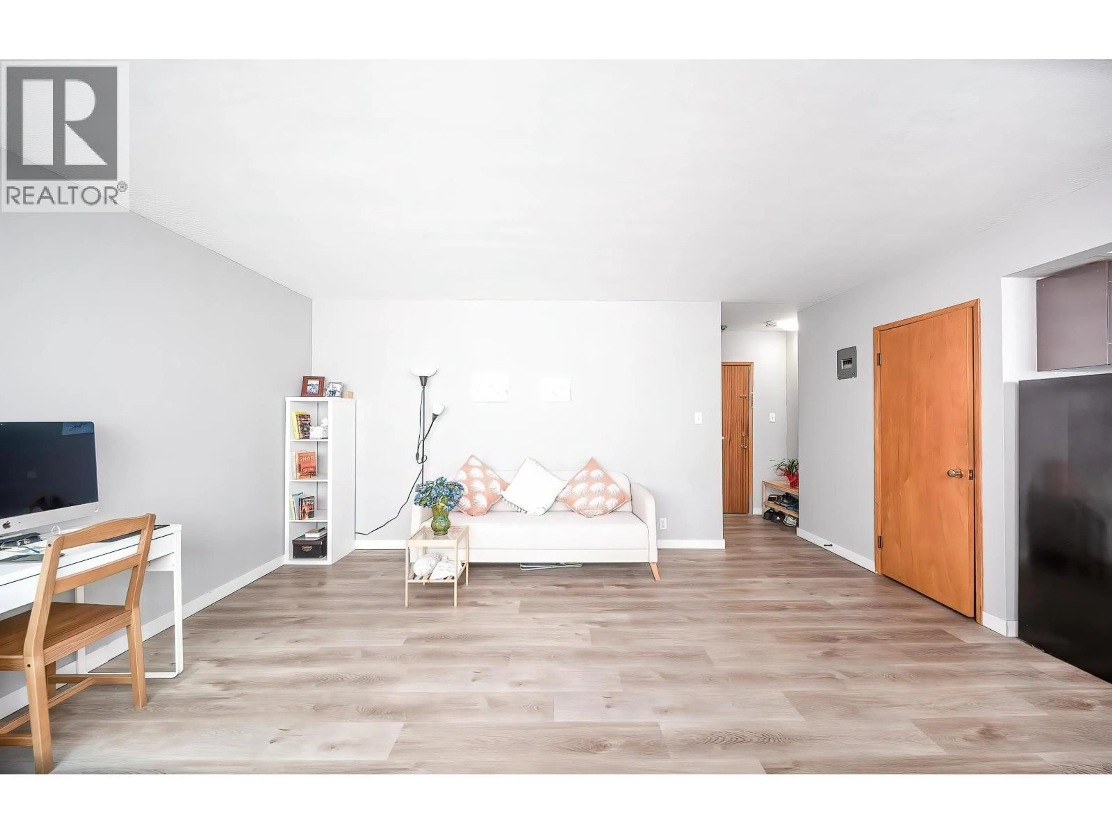 Living room with furniture, wood/laminate floor for 108 - 8622 SELKIRK STREET, Vancouver British Columbia V6P4J3