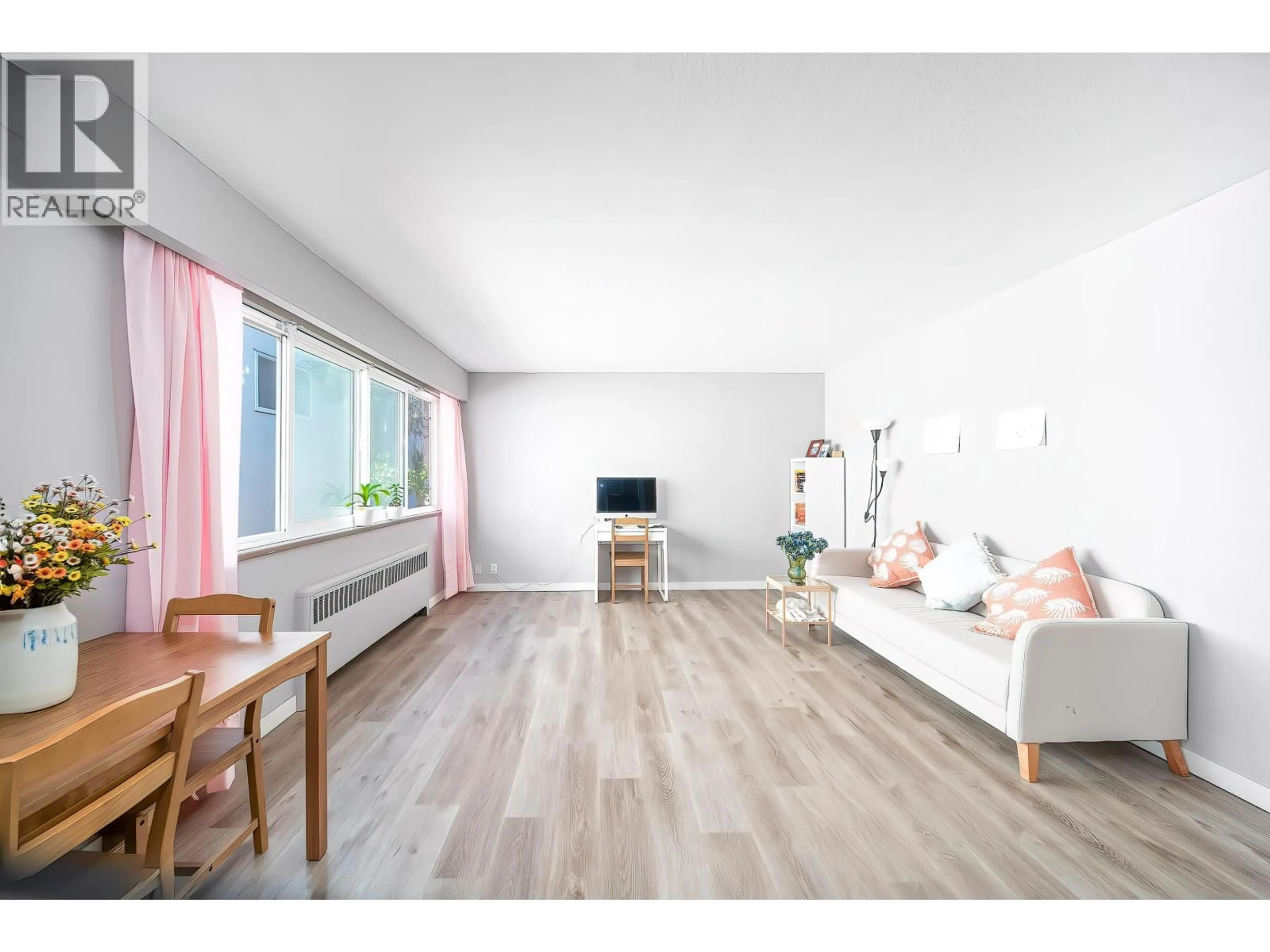 Living room with furniture, wood/laminate floor for 108 - 8622 SELKIRK STREET, Vancouver British Columbia V6P4J3