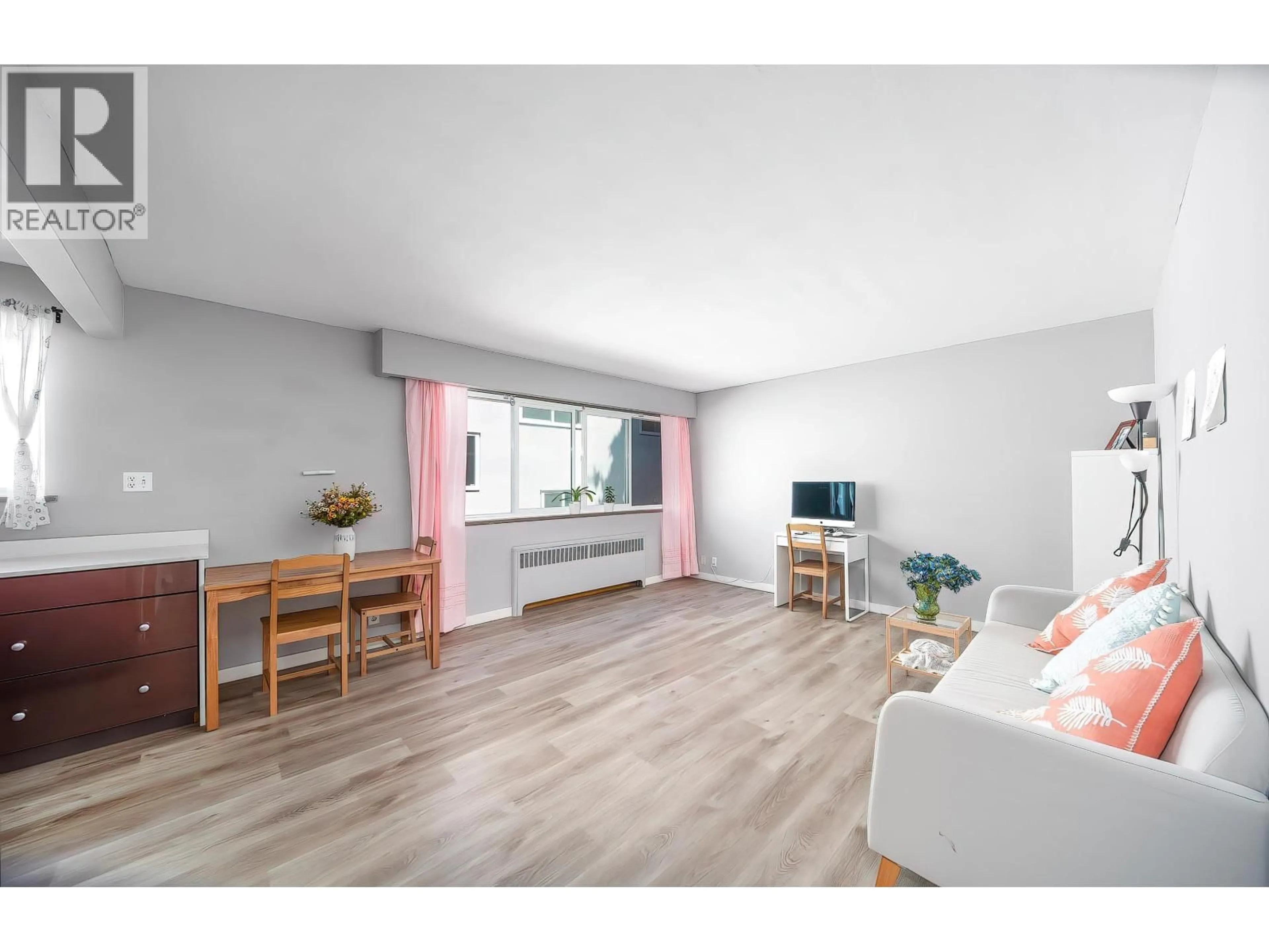 Living room with furniture, wood/laminate floor for 108 - 8622 SELKIRK STREET, Vancouver British Columbia V6P4J3