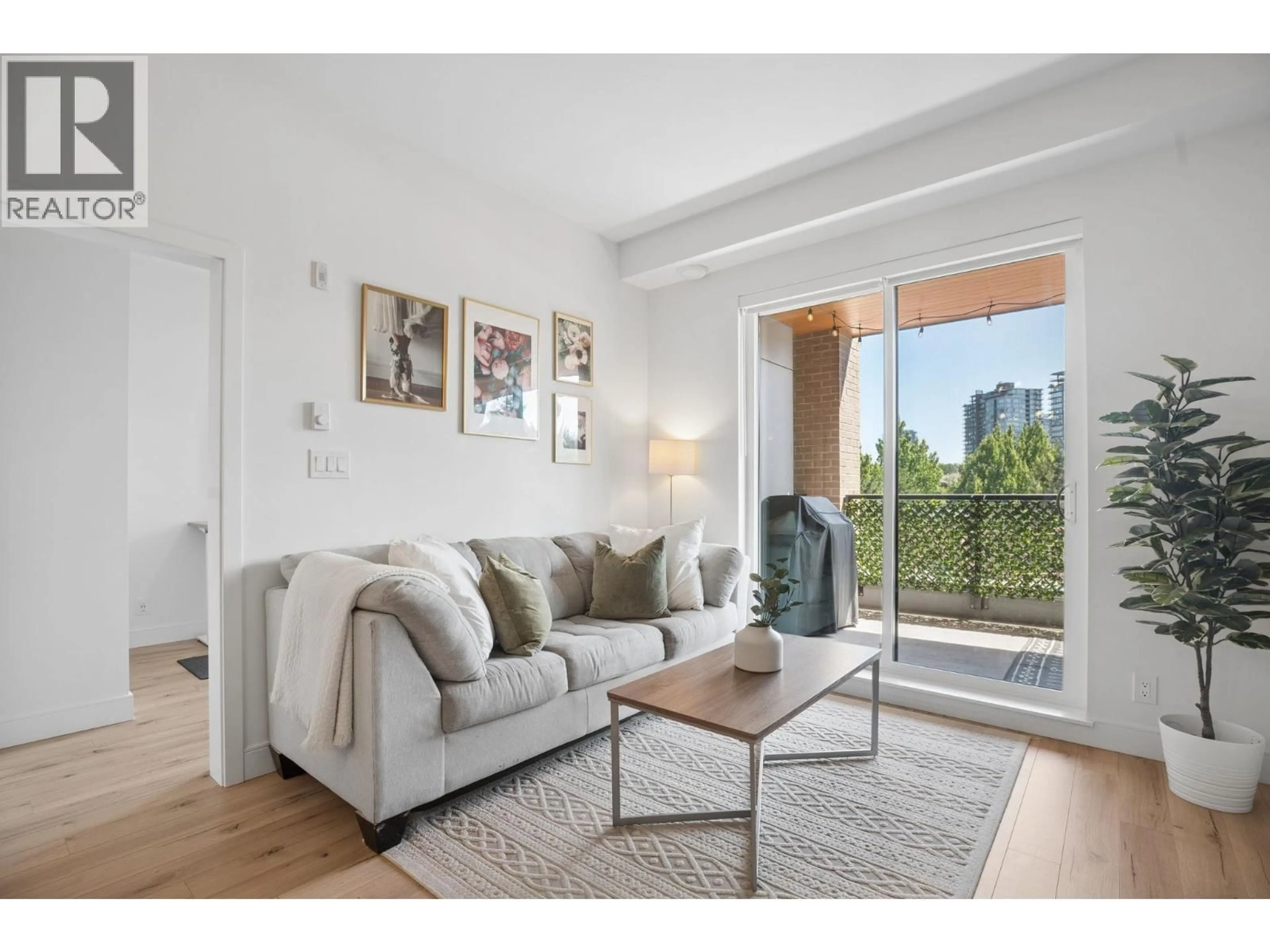 Living room with furniture, wood/laminate floor for 326 - 55 KLAHANIE DRIVE, Port Moody British Columbia V3H0M9