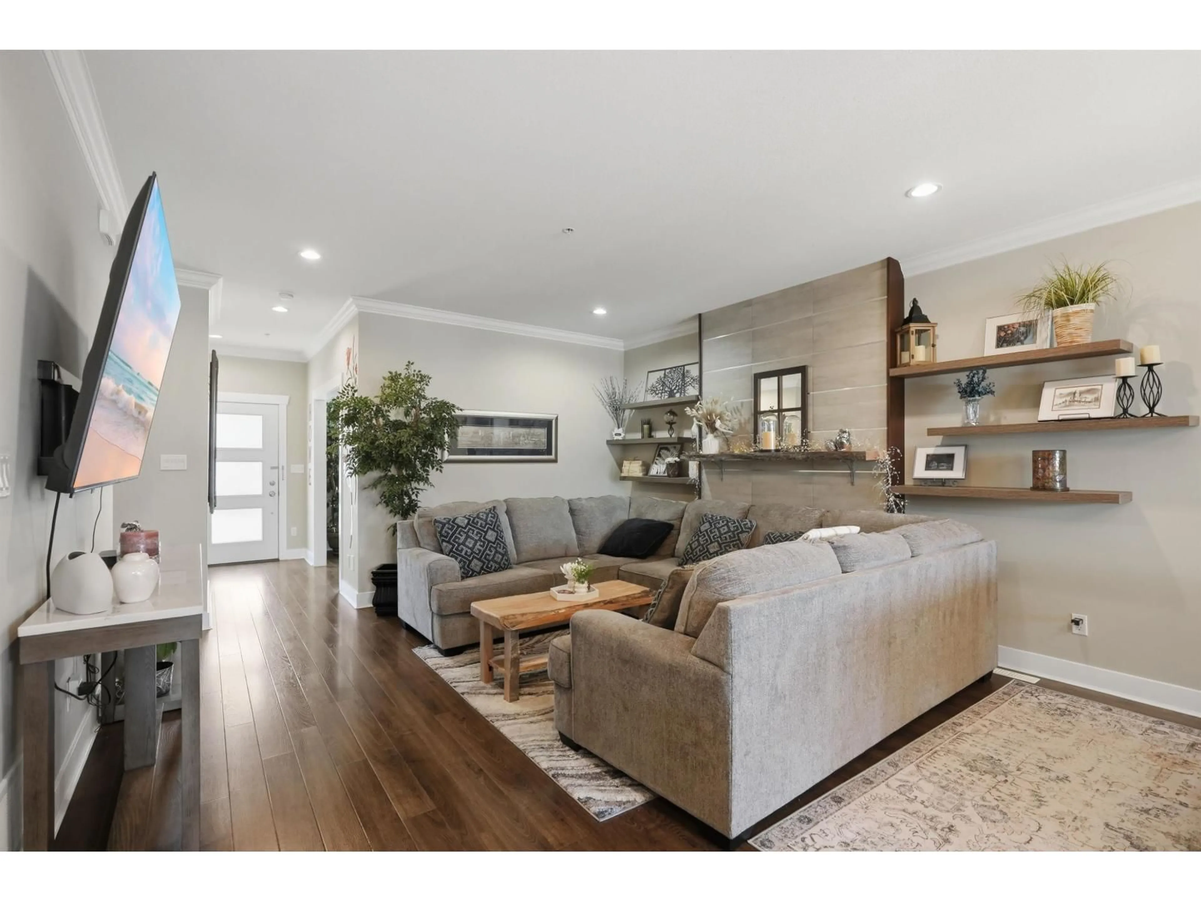 Living room with furniture, wood/laminate floor for 20919 80 AVENUE, Langley British Columbia V2Y0R3