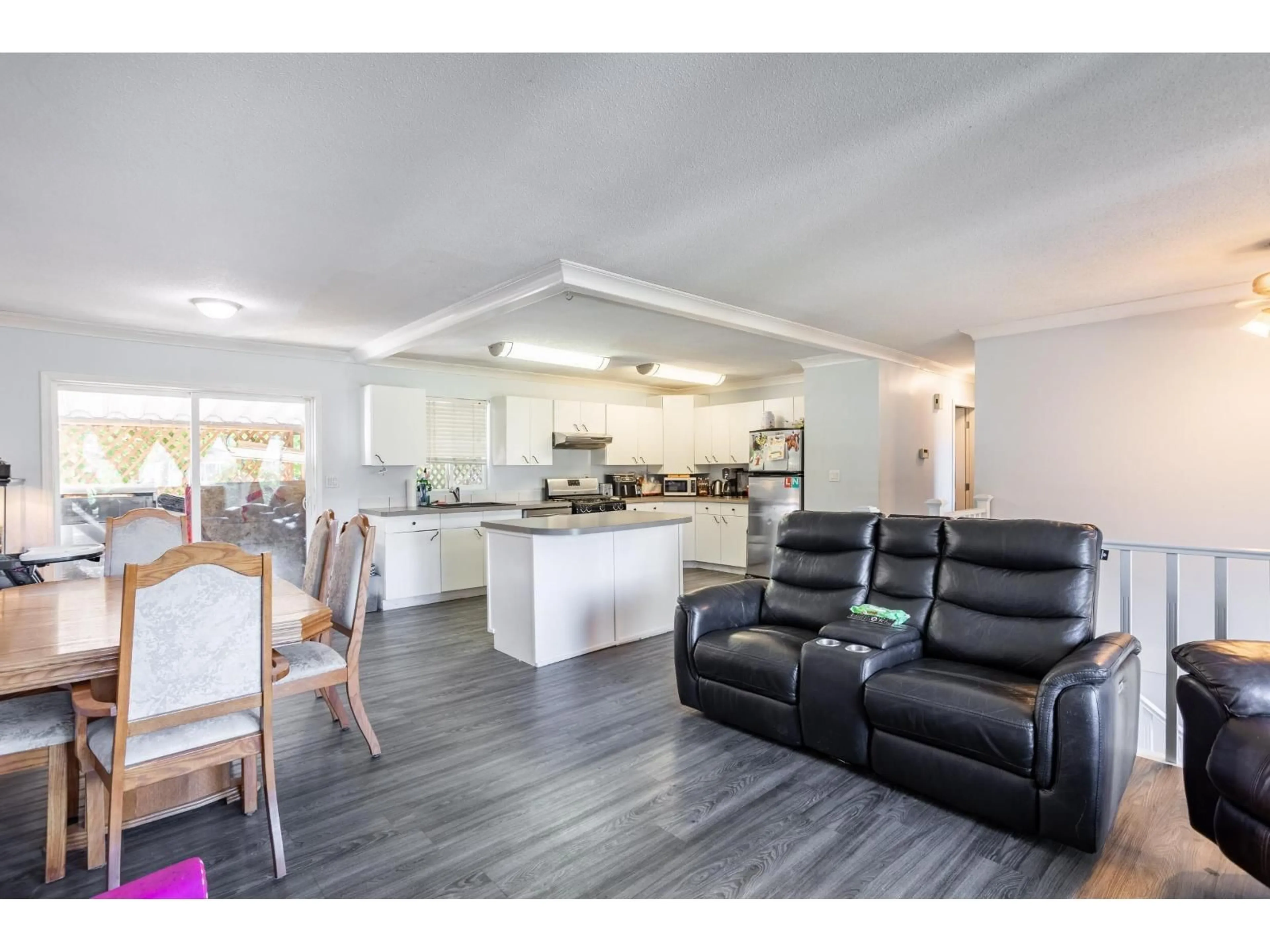 Open concept kitchen, wood/laminate floor for 27582 31B AVENUE, Langley British Columbia V4W3L3