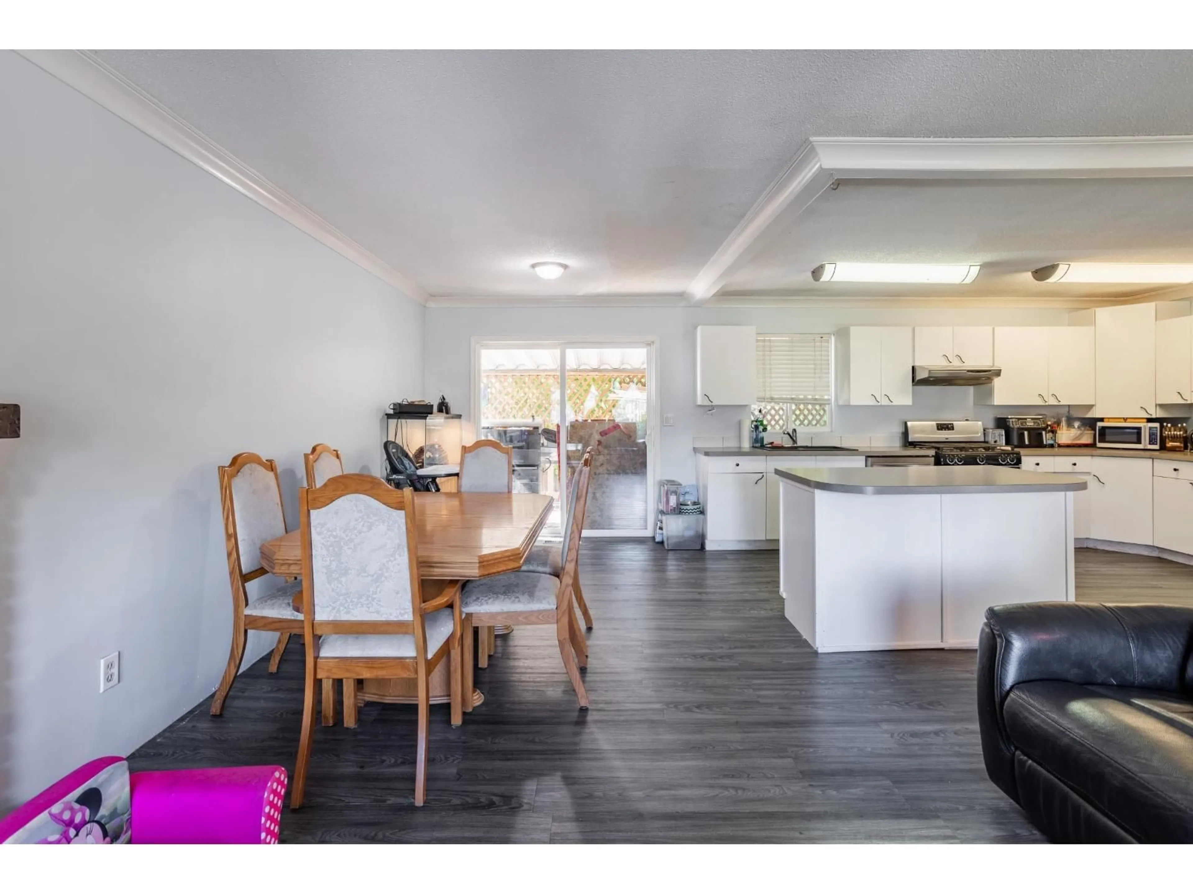Open concept kitchen, wood/laminate floor for 27582 31B AVENUE, Langley British Columbia V4W3L3