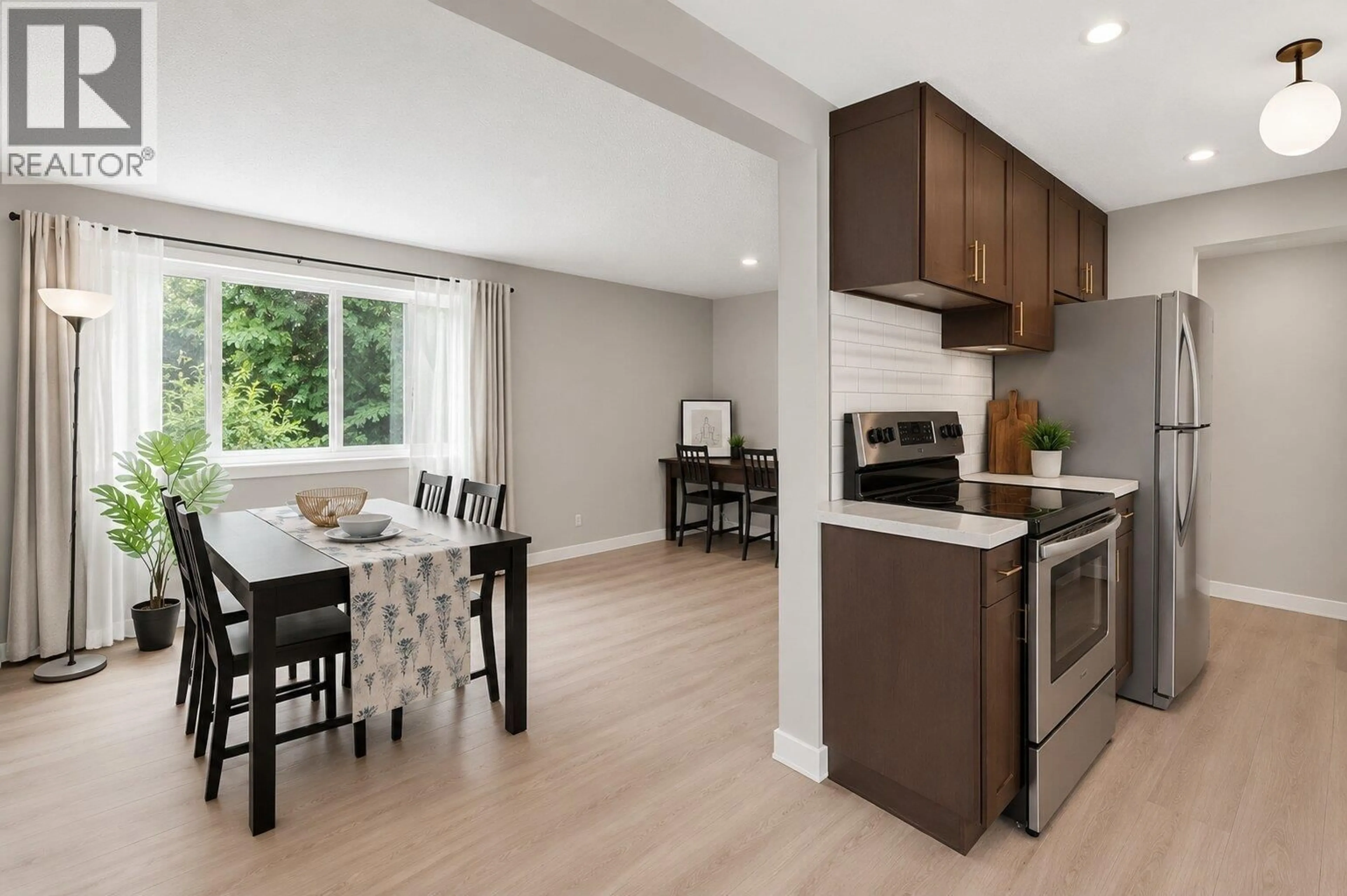 Open concept kitchen, wood/laminate floor for 122 - 3461 49TH AVENUE, Vancouver British Columbia V5S1M3