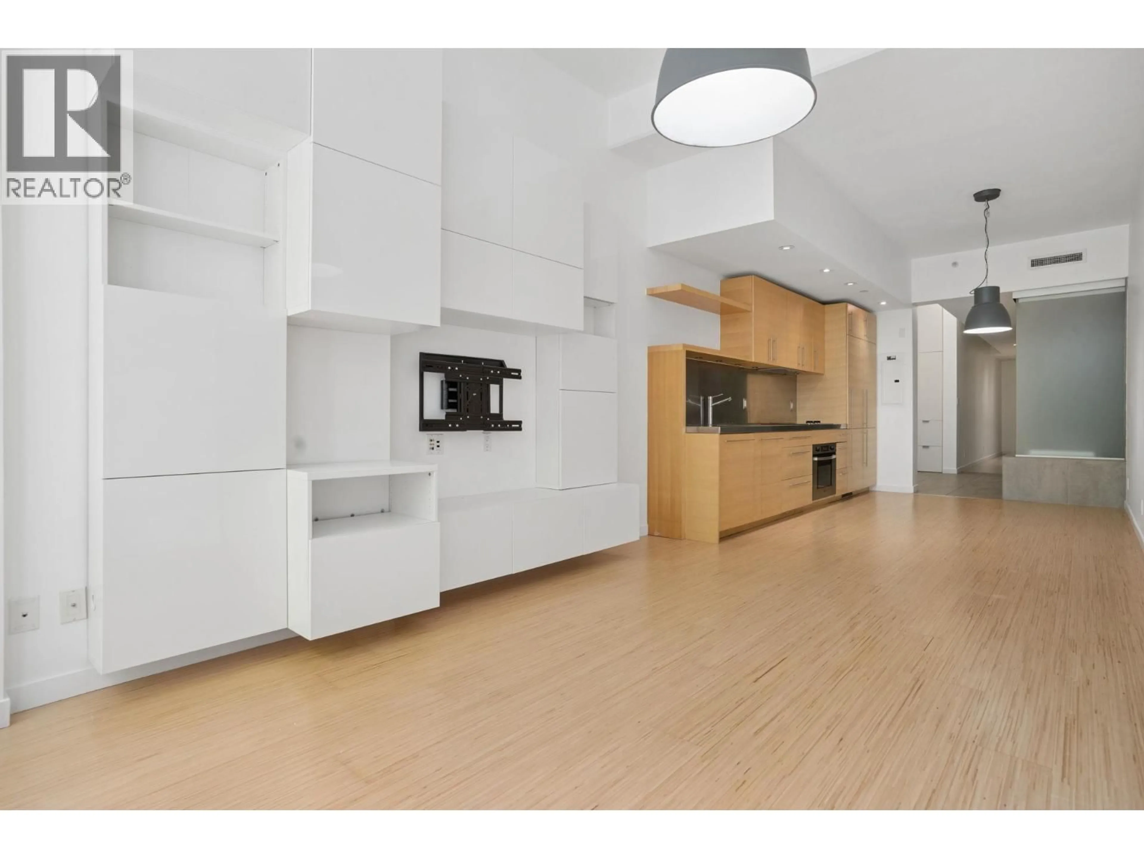 Open concept kitchen, wood/laminate floor for 202 - 36 WATER STREET, Vancouver British Columbia V6B0B7