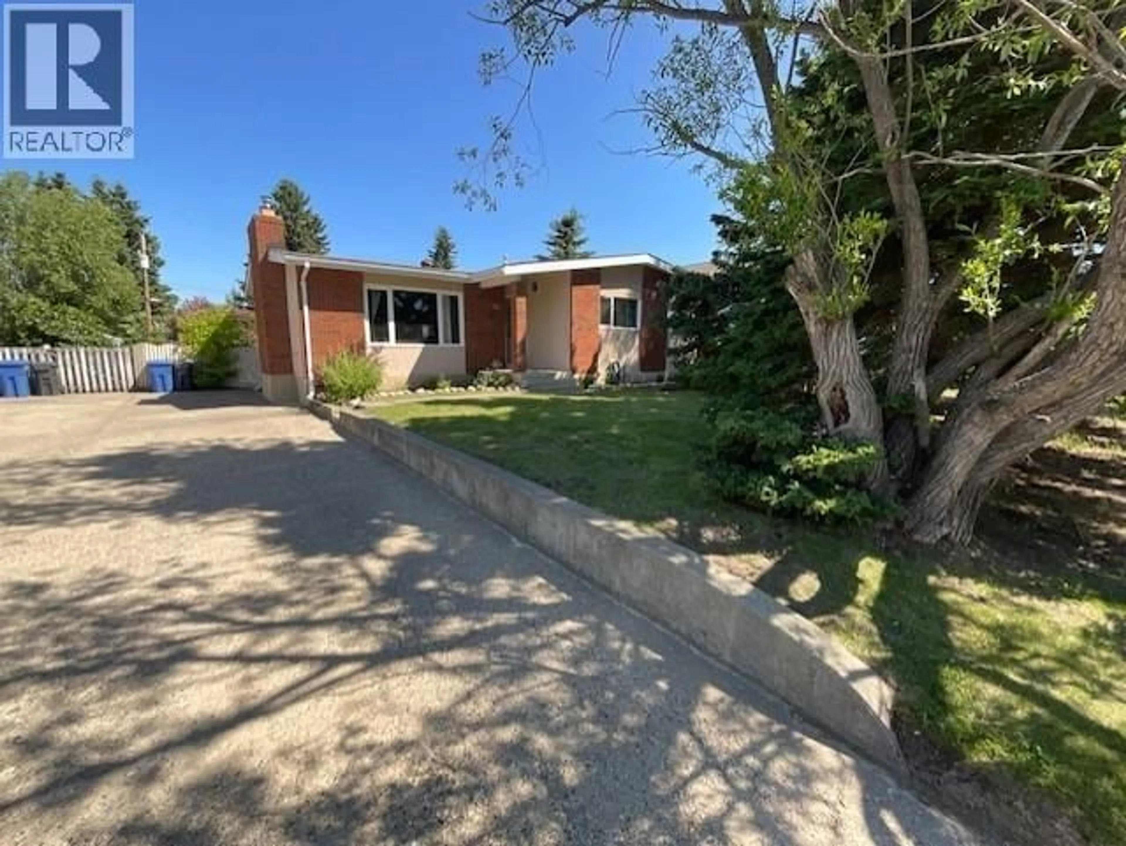 A pic from outside/outdoor area/front of a property/back of a property/a pic from drone, street for 9312 106 AVENUE, Fort St. John British Columbia V1J2N4
