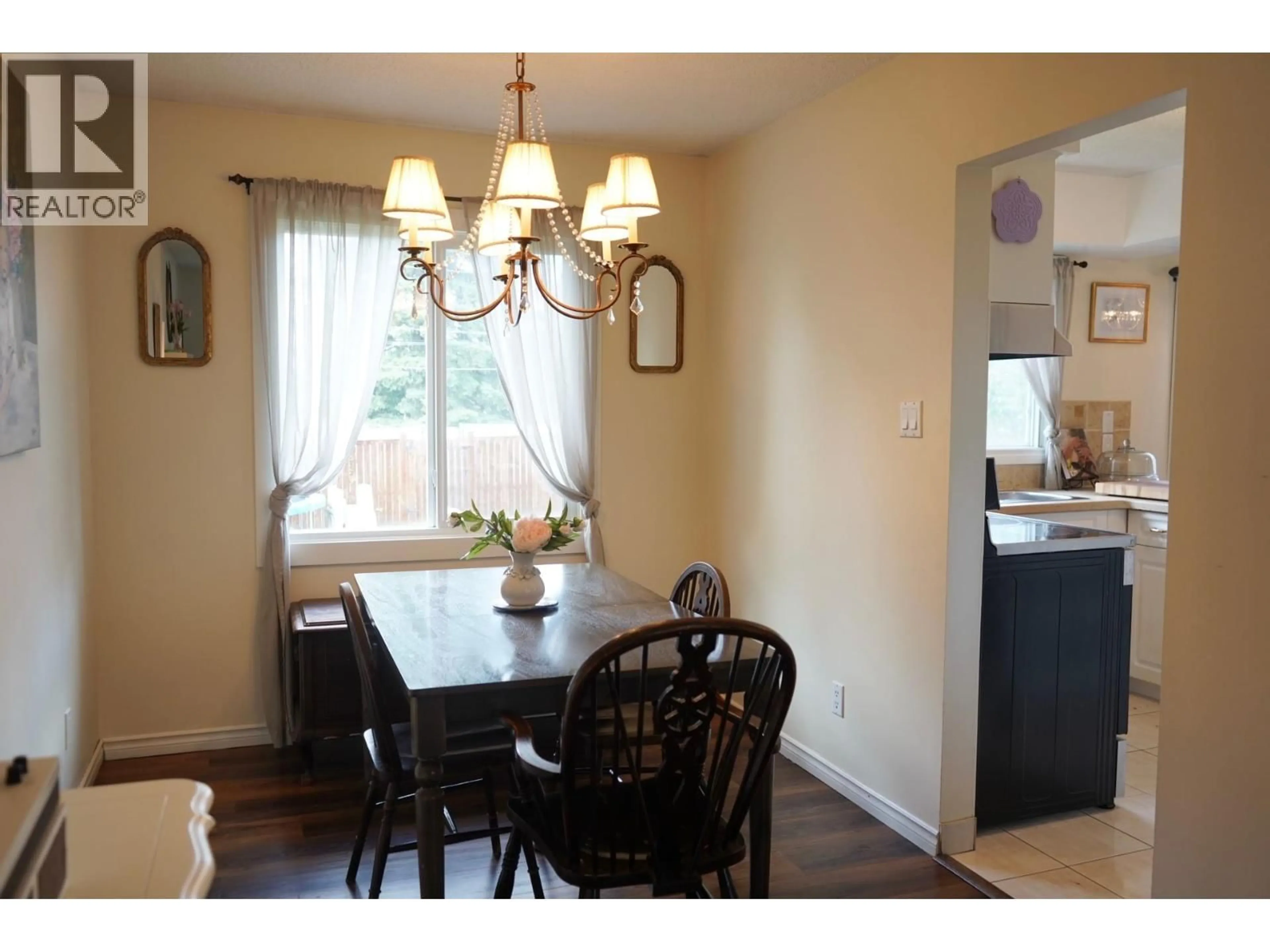 Dining room, wood/laminate floor for 9312 106 AVENUE, Fort St. John British Columbia V1J2N4