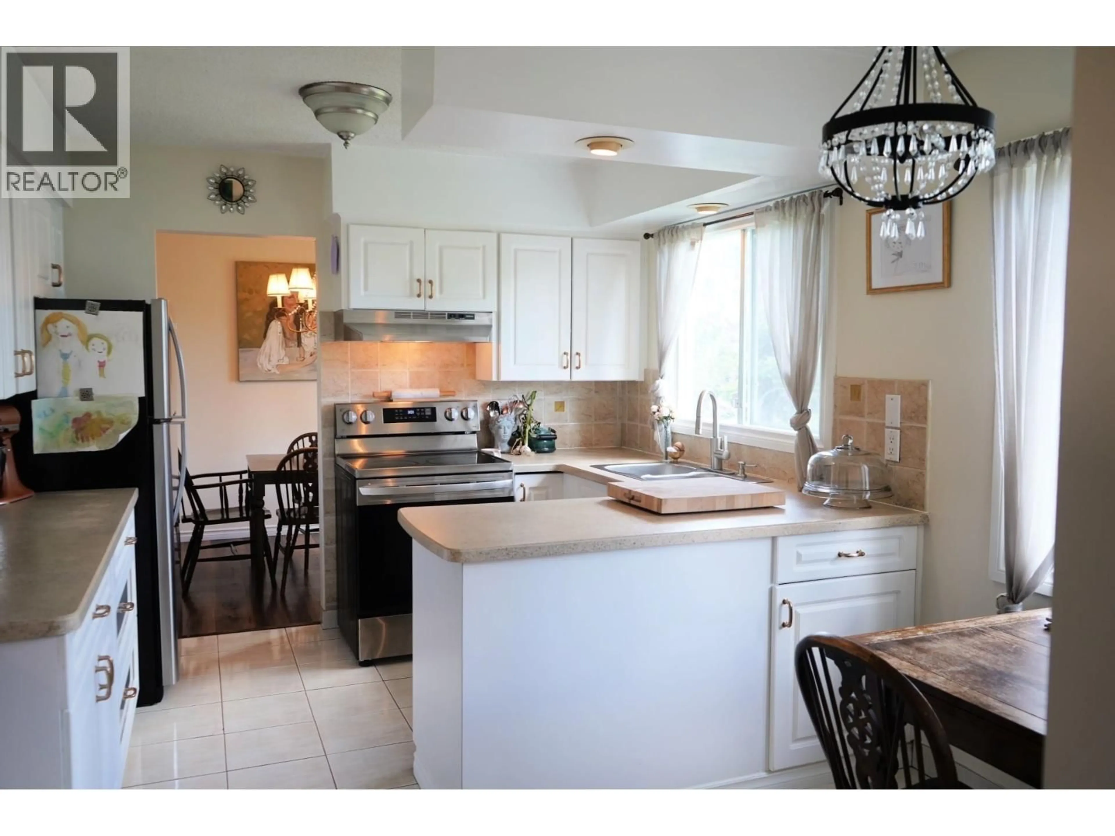 Open concept kitchen, ceramic/tile floor for 9312 106 AVENUE, Fort St. John British Columbia V1J2N4