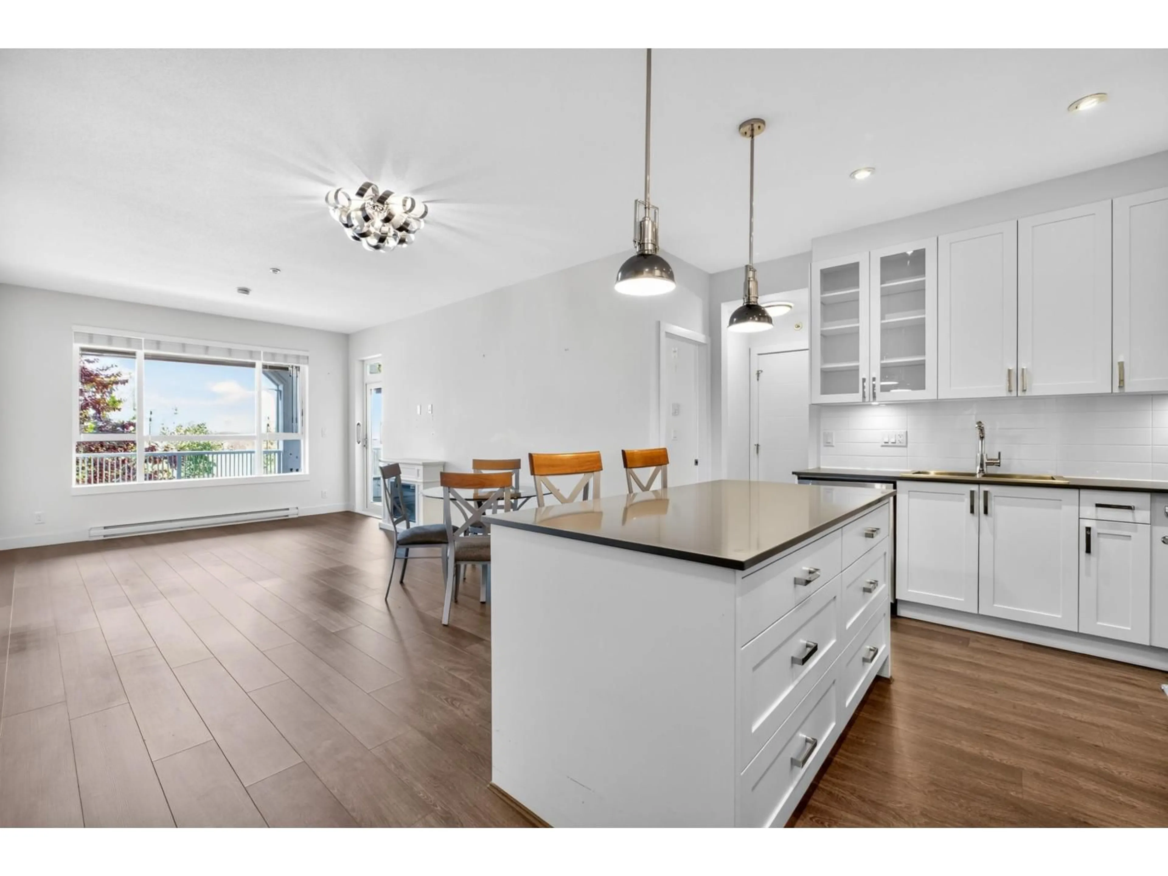 Open concept kitchen, wood/laminate floor for 309 - 16380 64 AVENUE, Surrey British Columbia V3S6X6