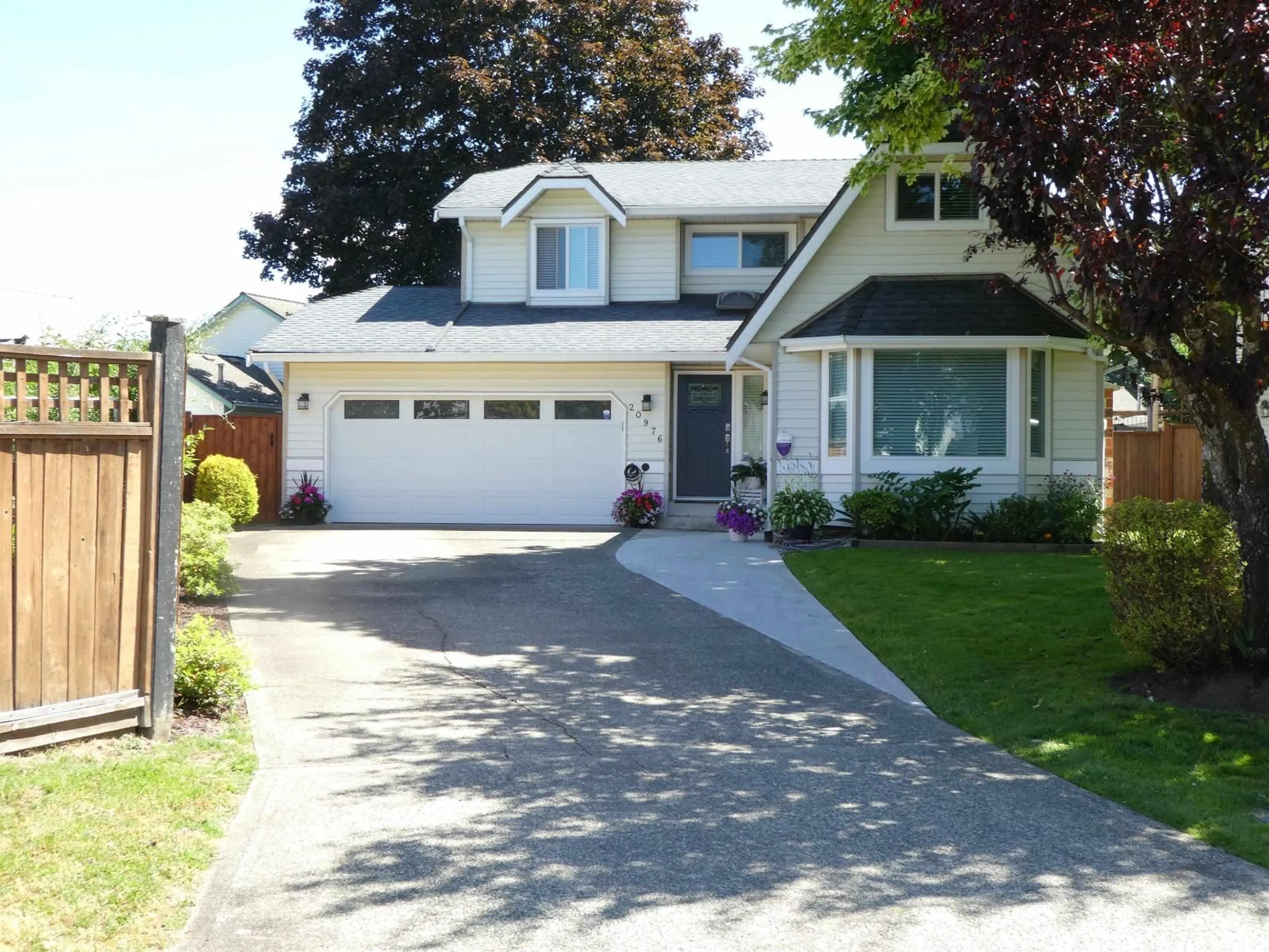 Home with vinyl exterior material, street for 20976 93B PLACE, Langley British Columbia V1M1S2