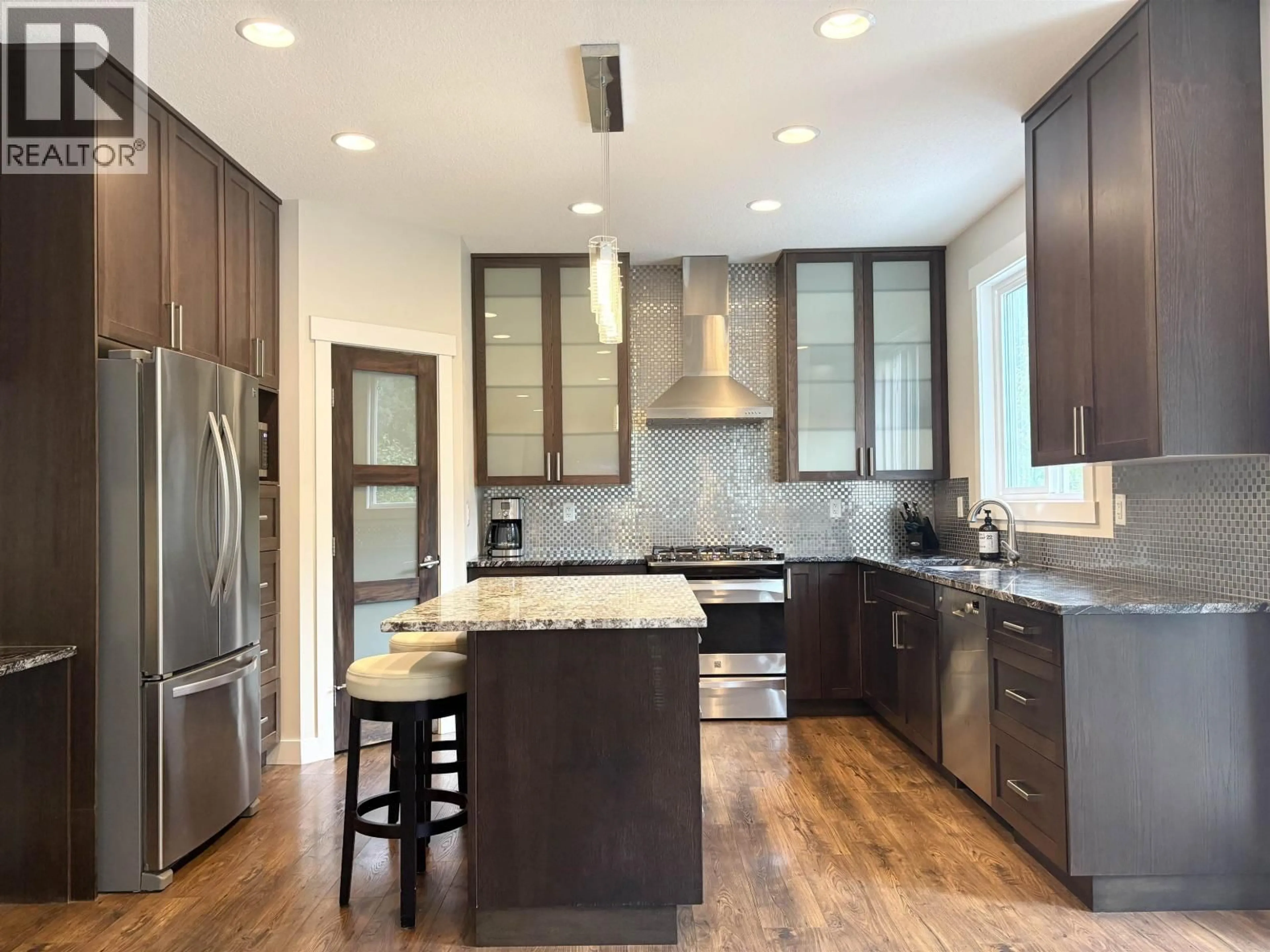 Contemporary kitchen, wood/laminate floor for 3808 BARNES DRIVE, Prince George British Columbia V2N0G4