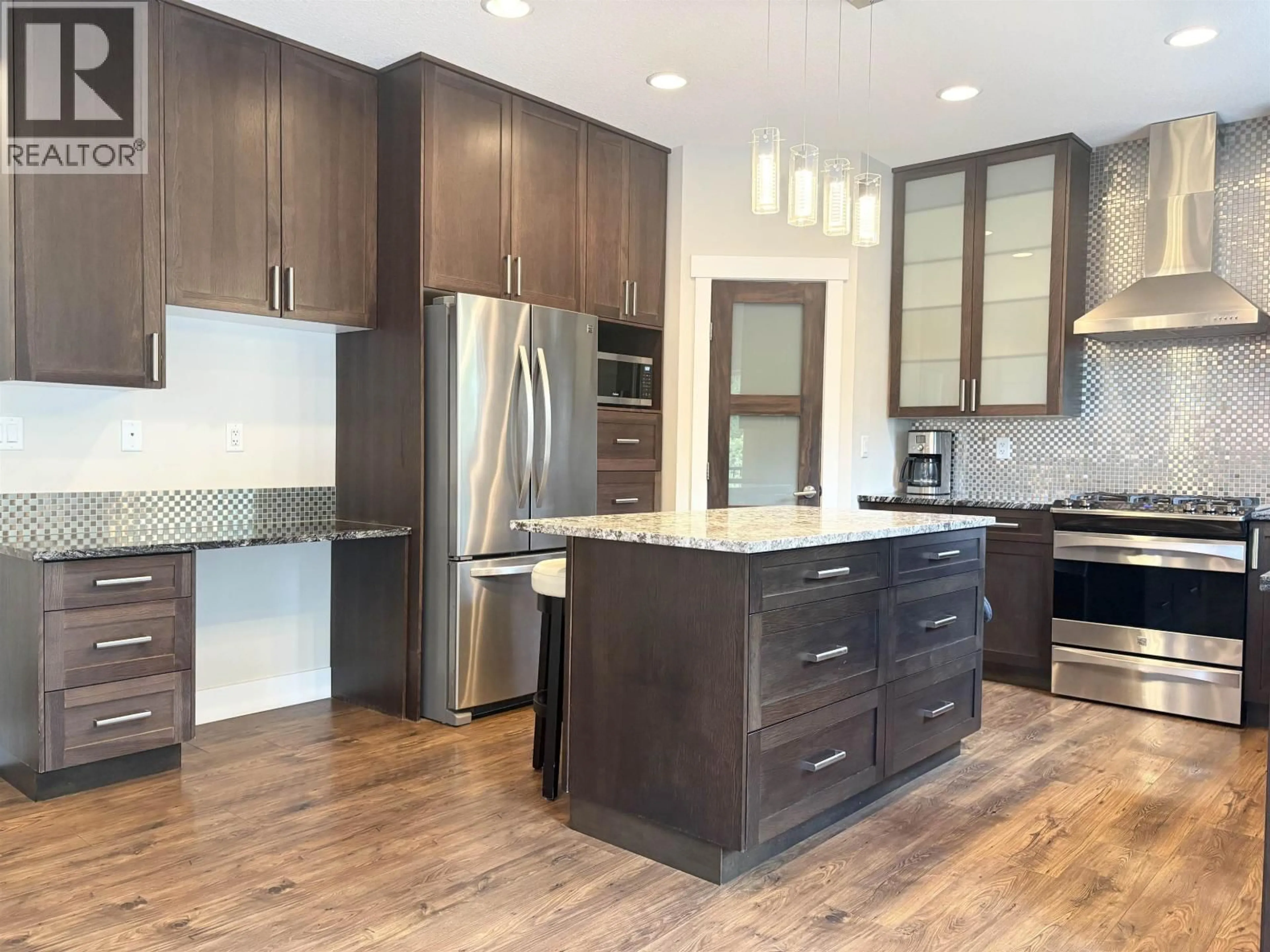 Contemporary kitchen, wood/laminate floor for 3808 BARNES DRIVE, Prince George British Columbia V2N0G4