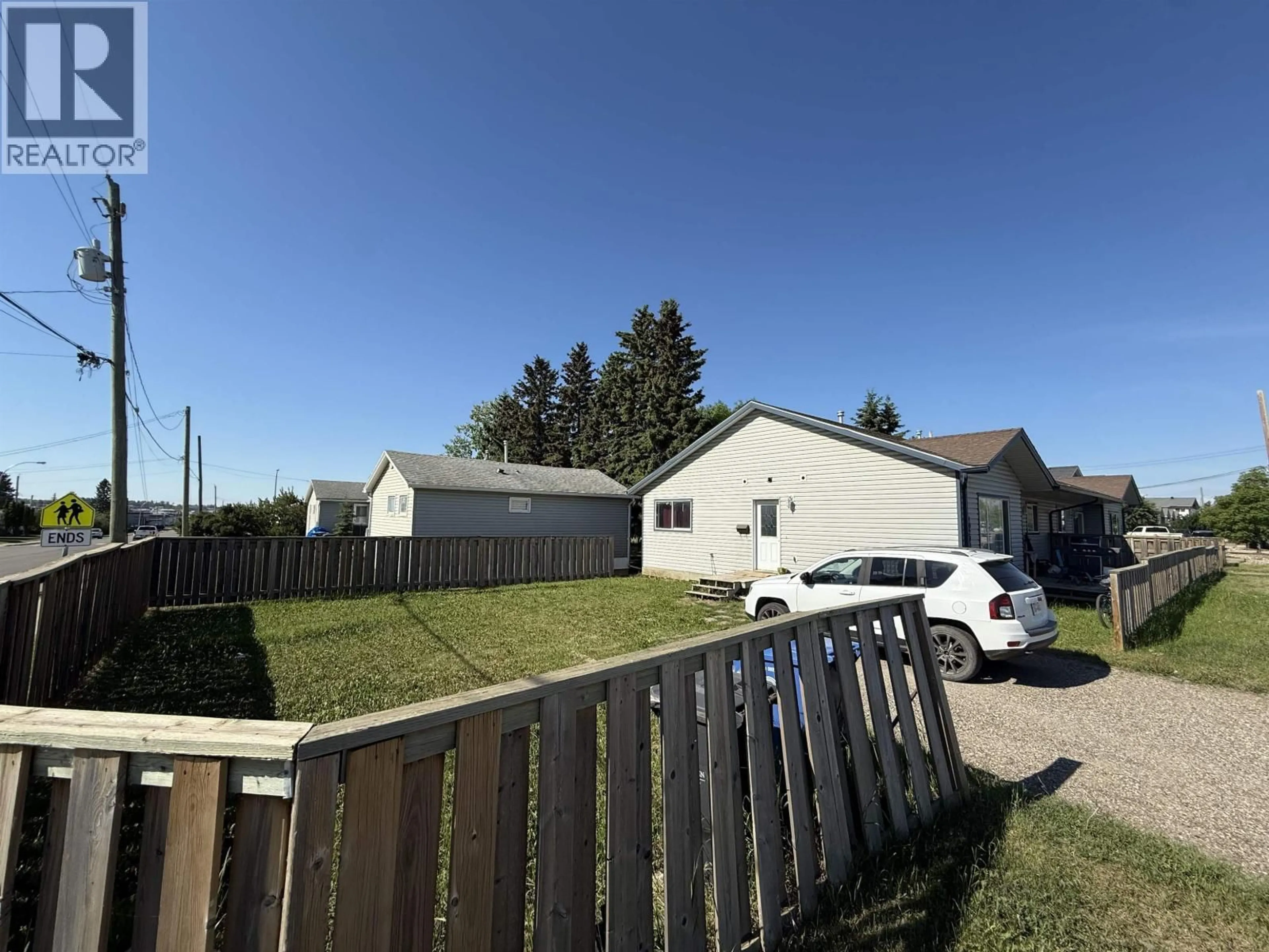 A pic from outside/outdoor area/front of a property/back of a property/a pic from drone, street for 10203 98 AVENUE, Fort St. John British Columbia V1J0B1