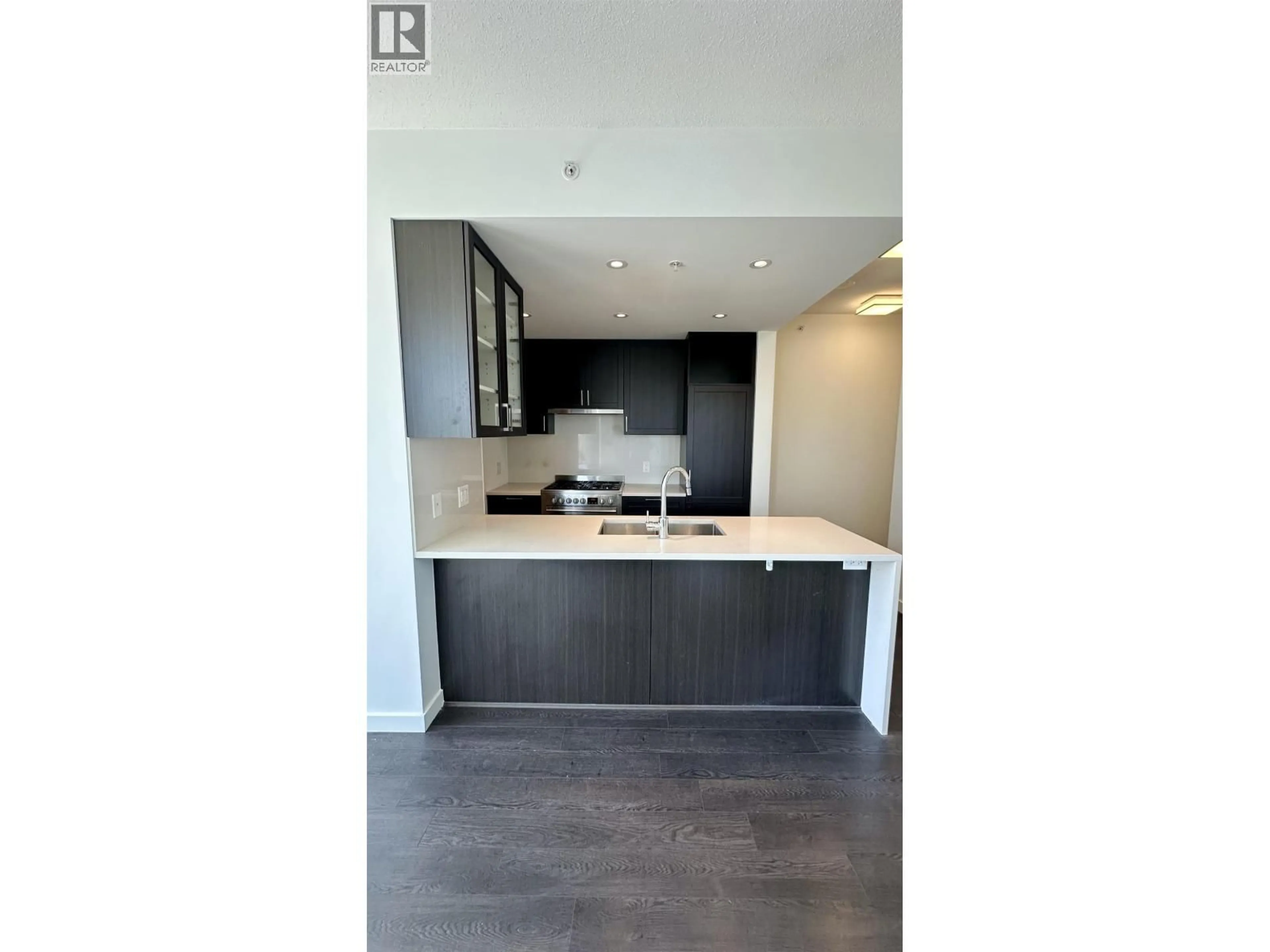 Open concept kitchen, wood/laminate floor for 3301 - 5470 ORMIDALE STREET, Vancouver British Columbia V5C0L9