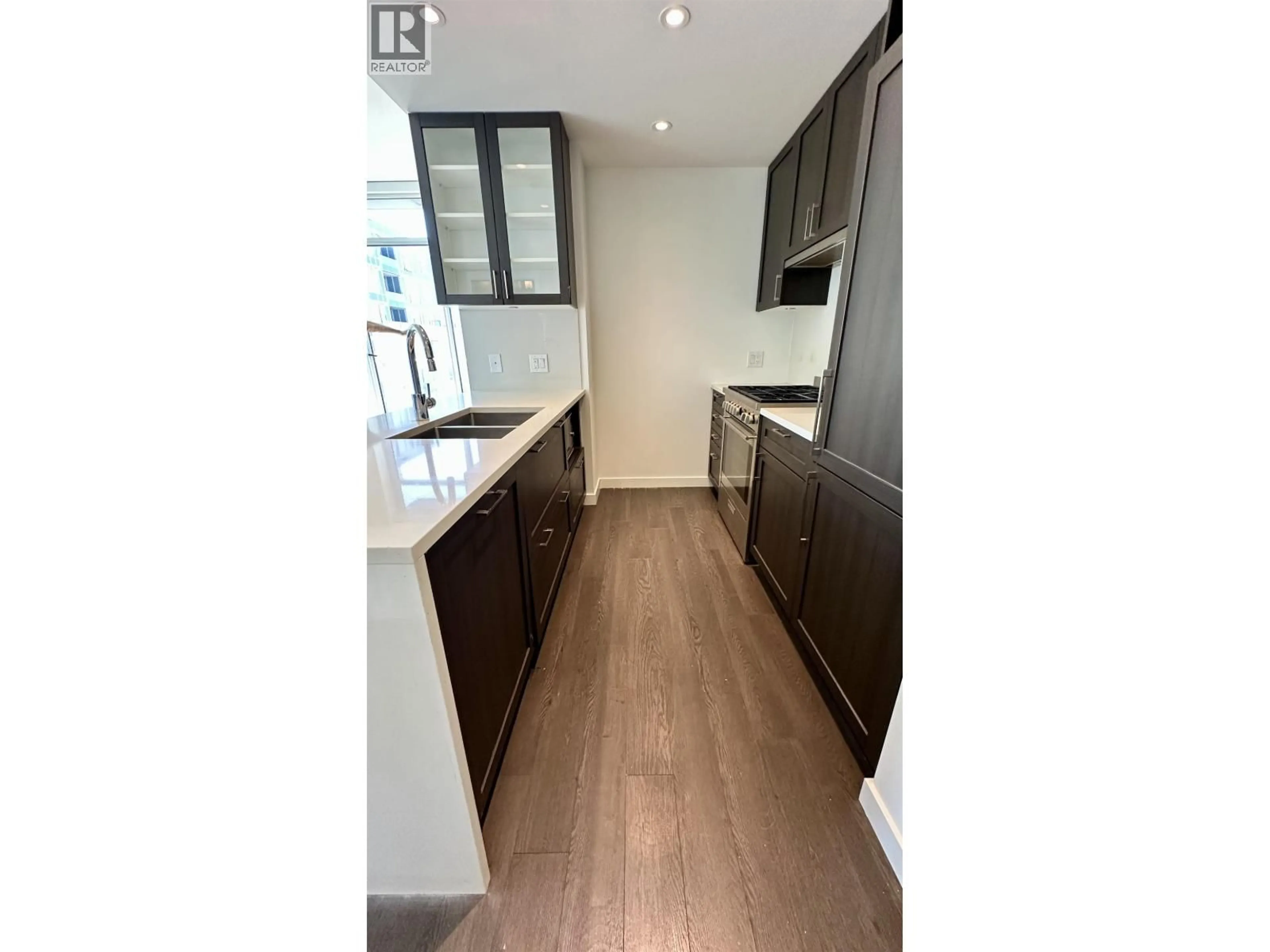 Open concept kitchen, wood/laminate floor for 3301 - 5470 ORMIDALE STREET, Vancouver British Columbia V5C0L9