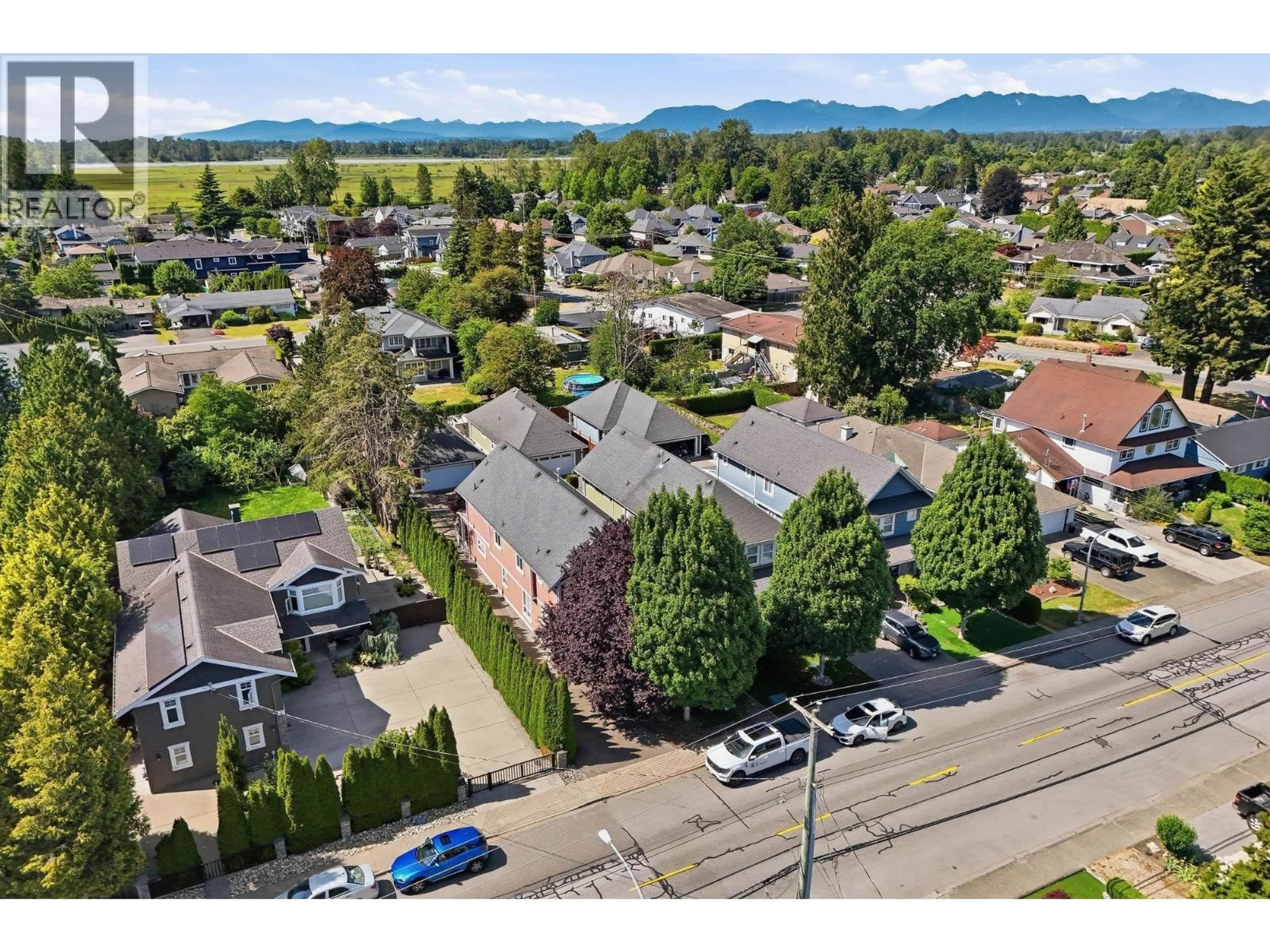 A pic from outside/outdoor area/front of a property/back of a property/a pic from drone, mountain view for A - 5013 CENTRAL AVENUE, Delta British Columbia V4K2G5