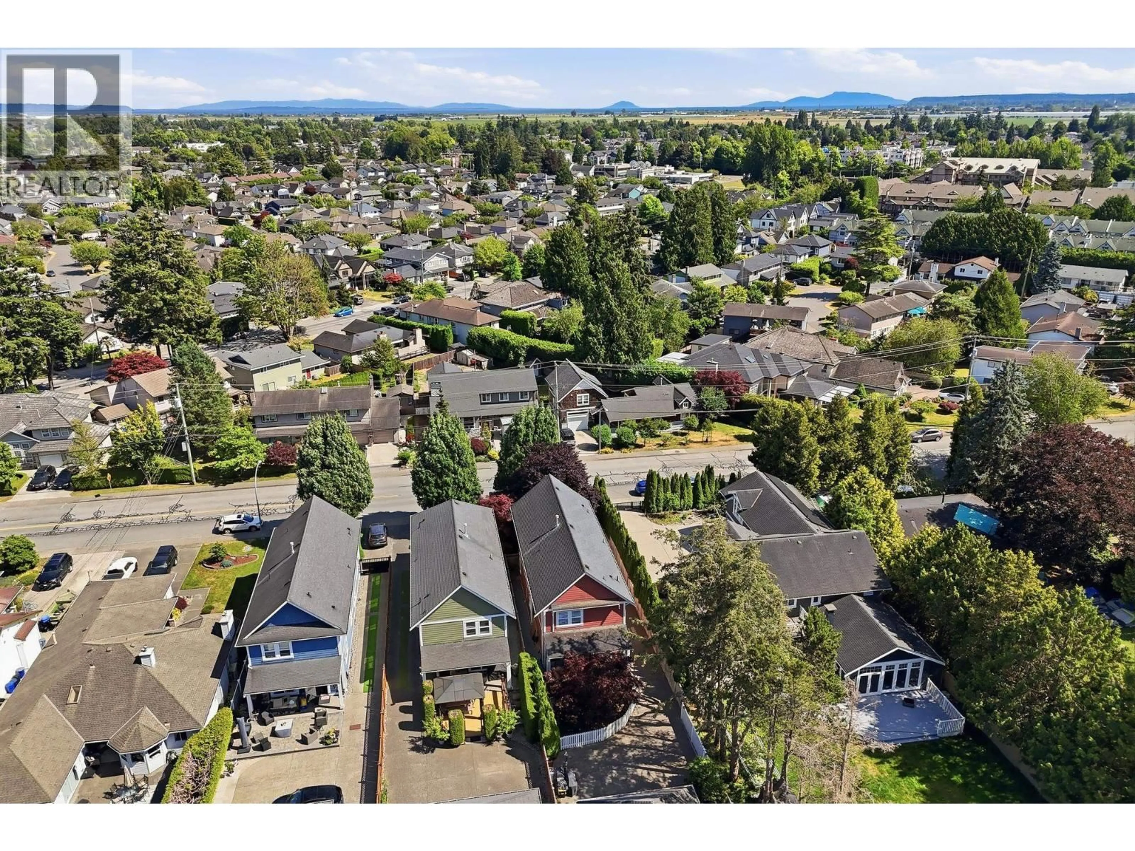 A pic from outside/outdoor area/front of a property/back of a property/a pic from drone, mountain view for A - 5013 CENTRAL AVENUE, Delta British Columbia V4K2G5