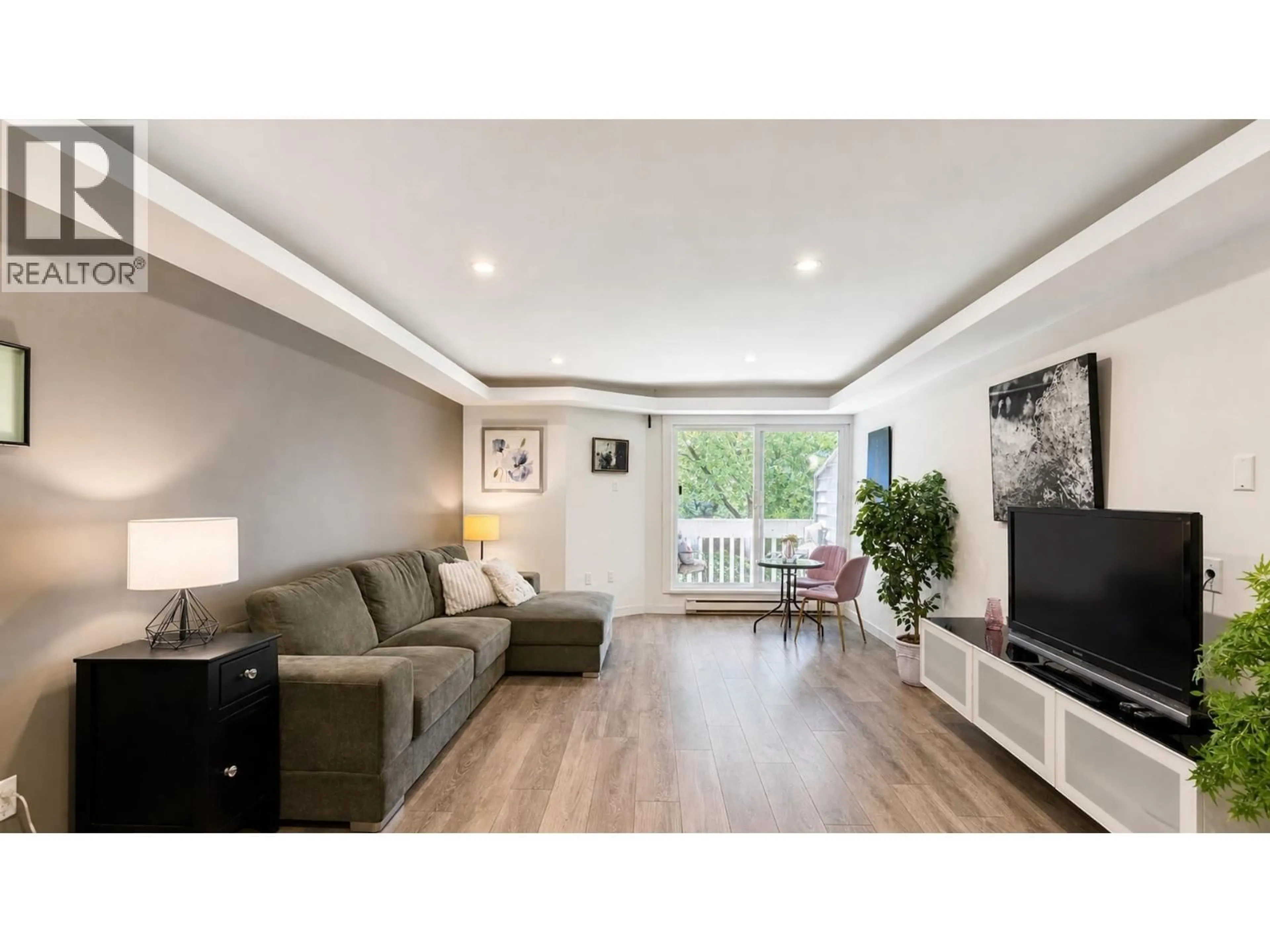 Living room with furniture, wood/laminate floor for 214 - 1545 2ND AVENUE, Vancouver British Columbia V5N1C8