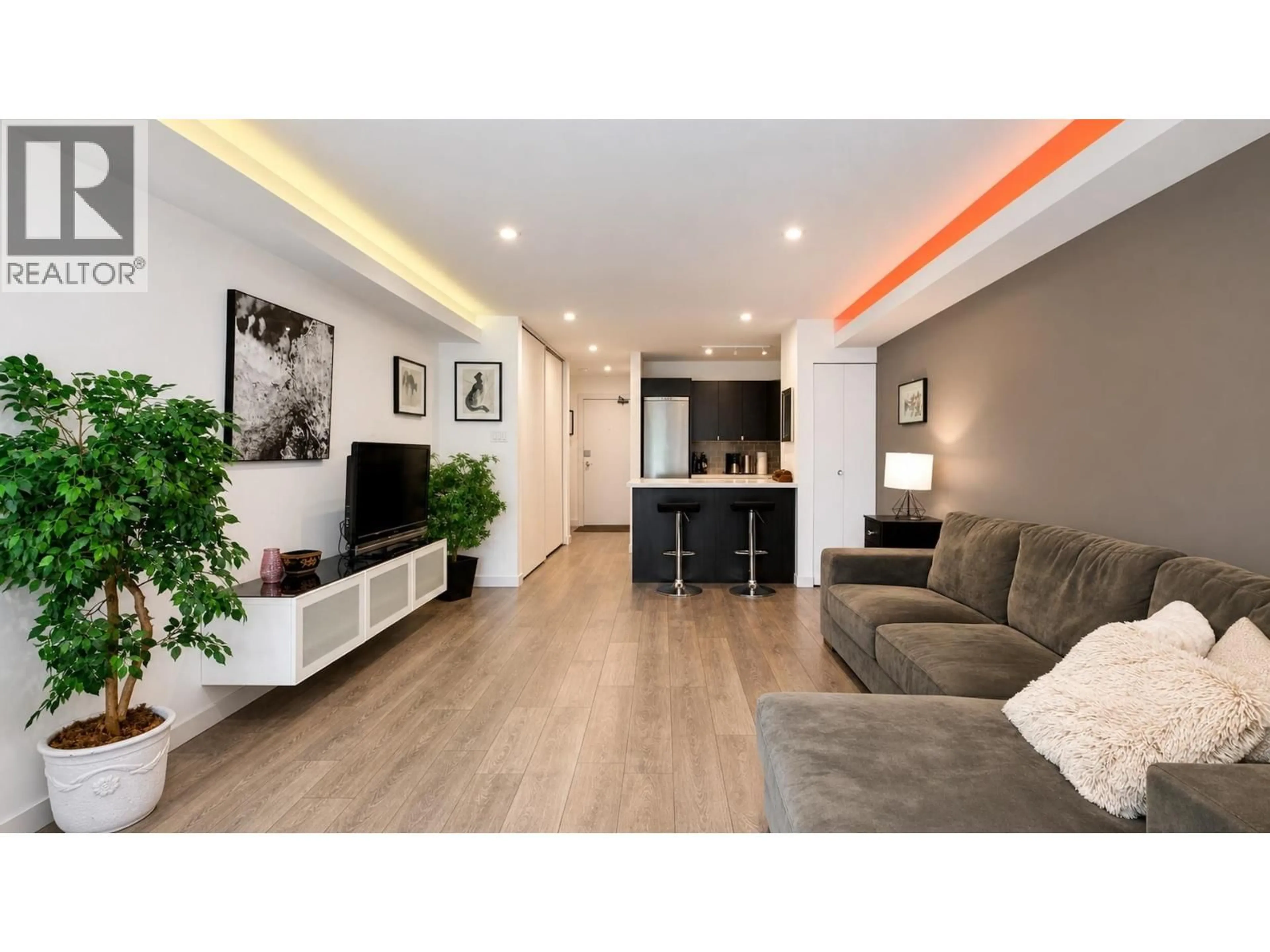Living room with furniture, wood/laminate floor for 214 - 1545 2ND AVENUE, Vancouver British Columbia V5N1C8