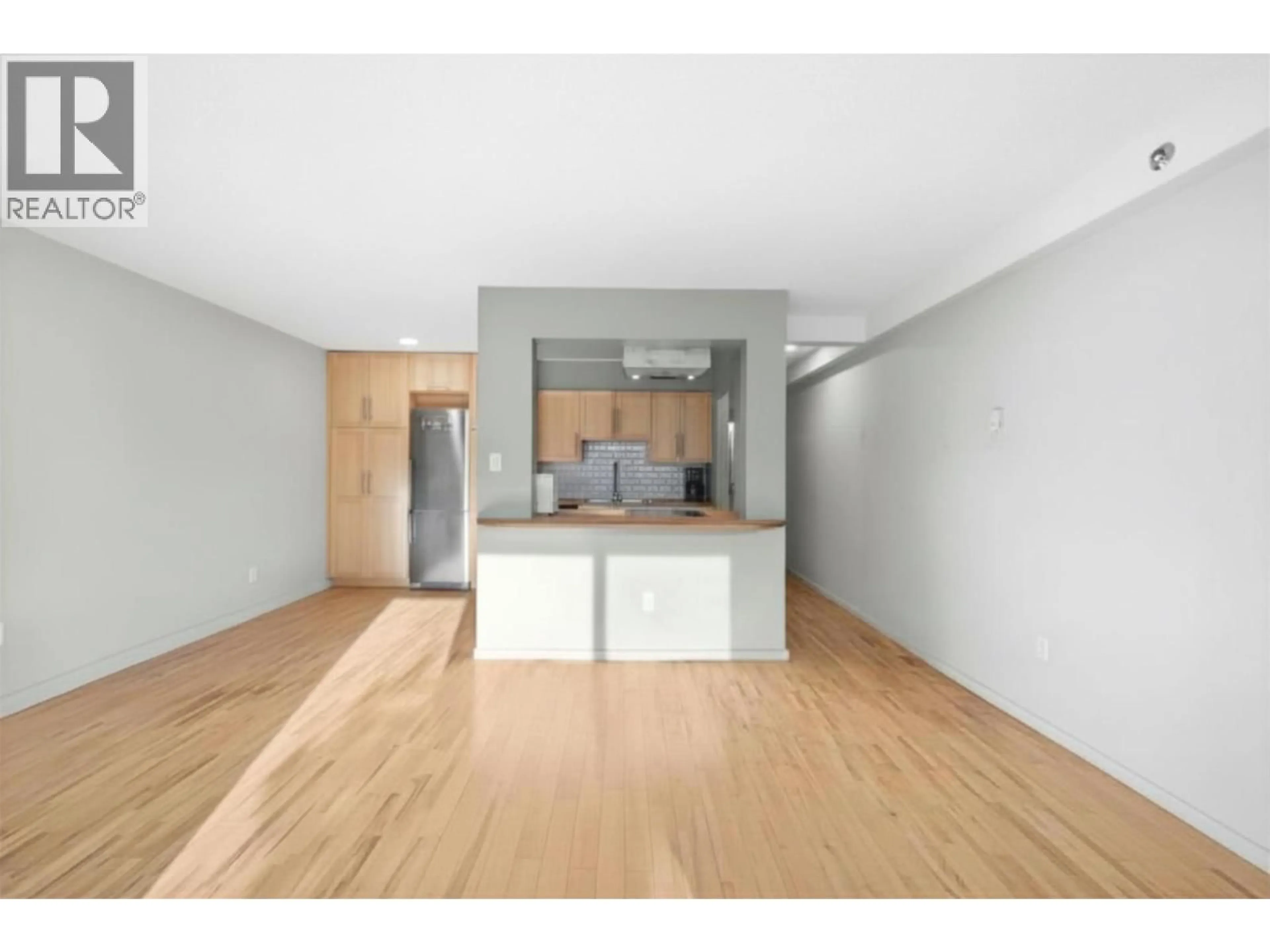 Open concept kitchen, wood/laminate floor for 104 - 1549 KITCHENER STREET, Vancouver British Columbia V5L2V8