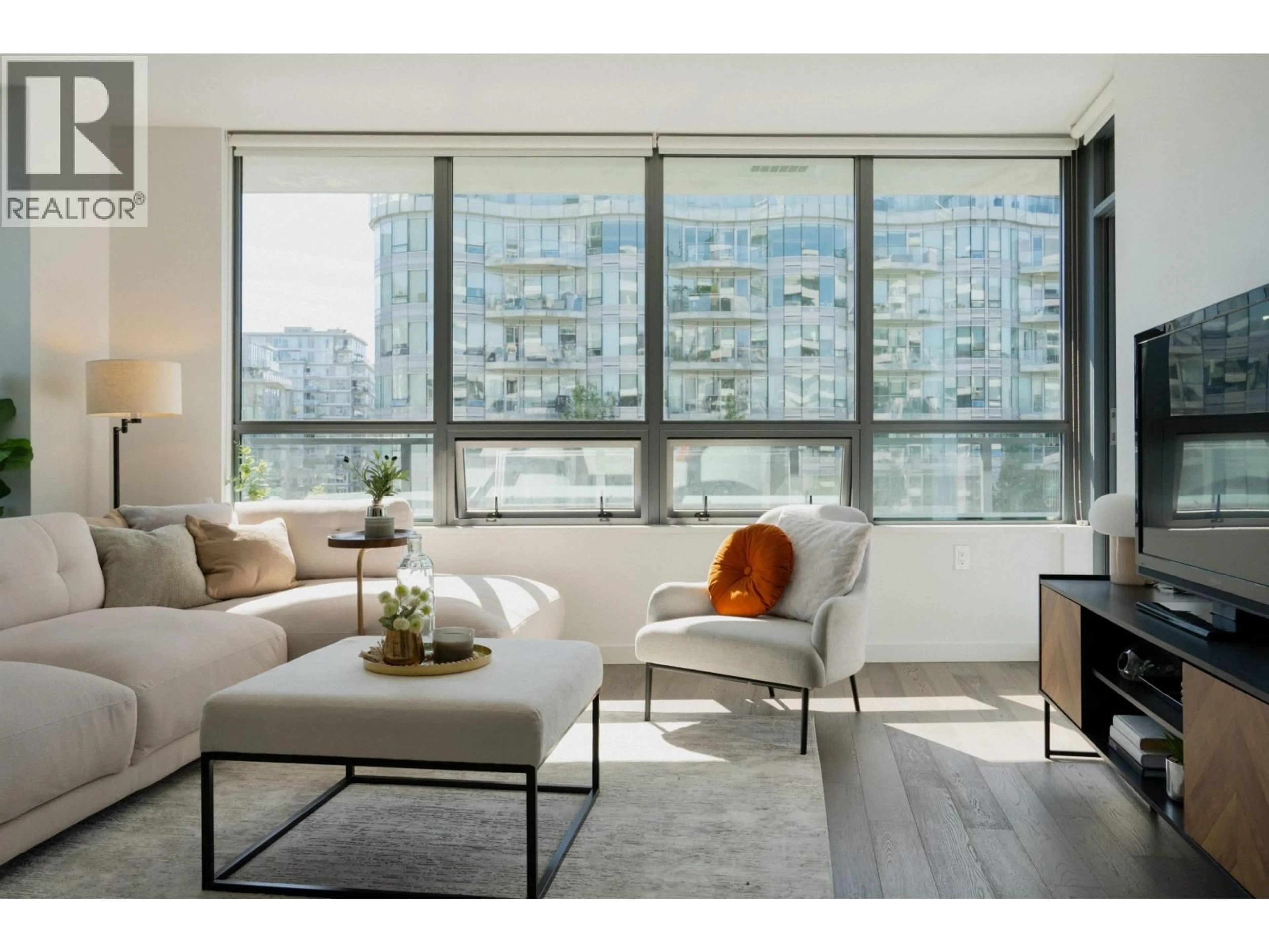 Living room with furniture, wood/laminate floor for 604 - 1688 PULLMAN PORTER STREET, Vancouver British Columbia V6A0H3