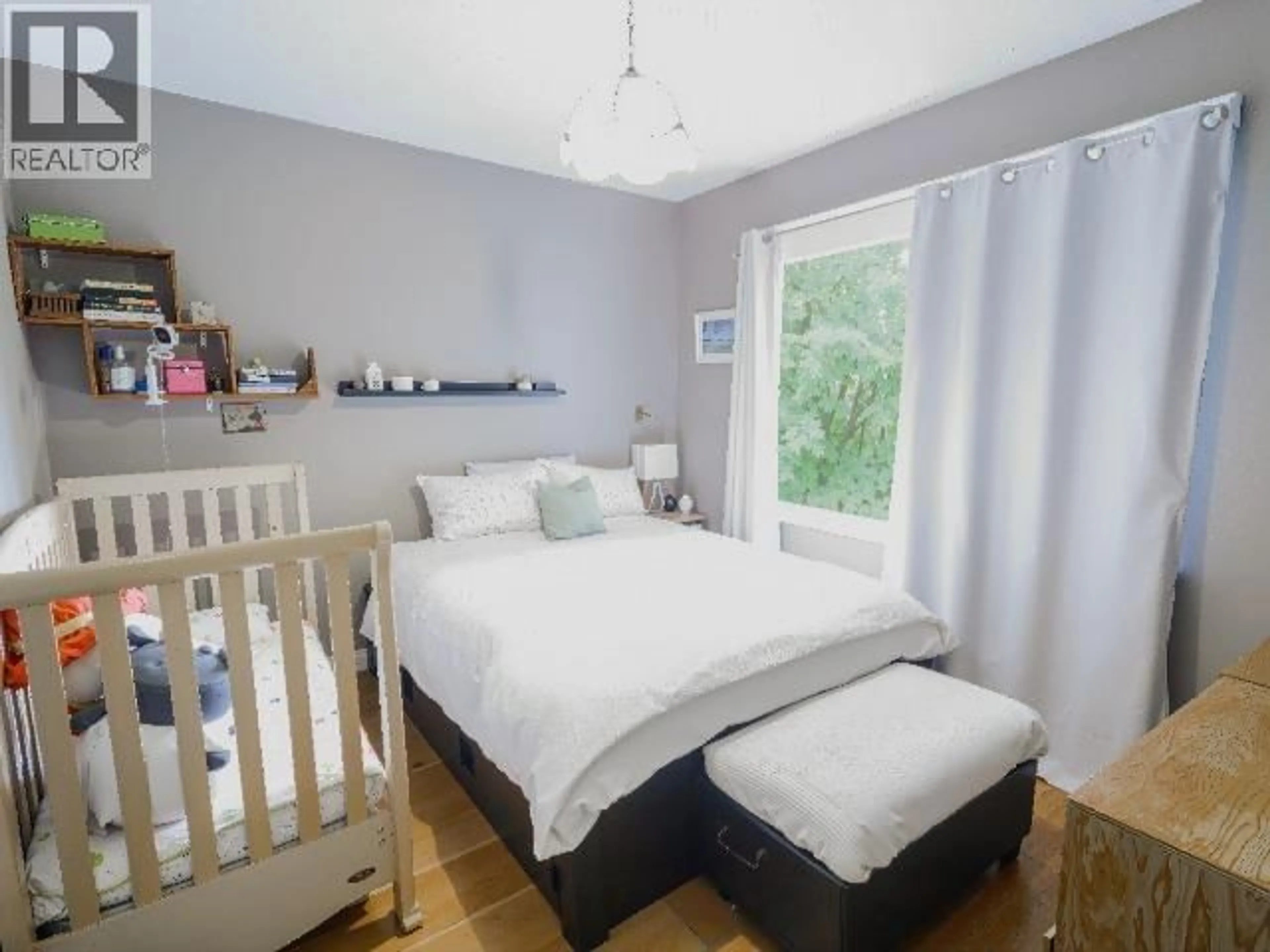 Bedroom with bed, wood/laminate floor for 550 CASSIAR STREET, Vancouver British Columbia V5K4M9