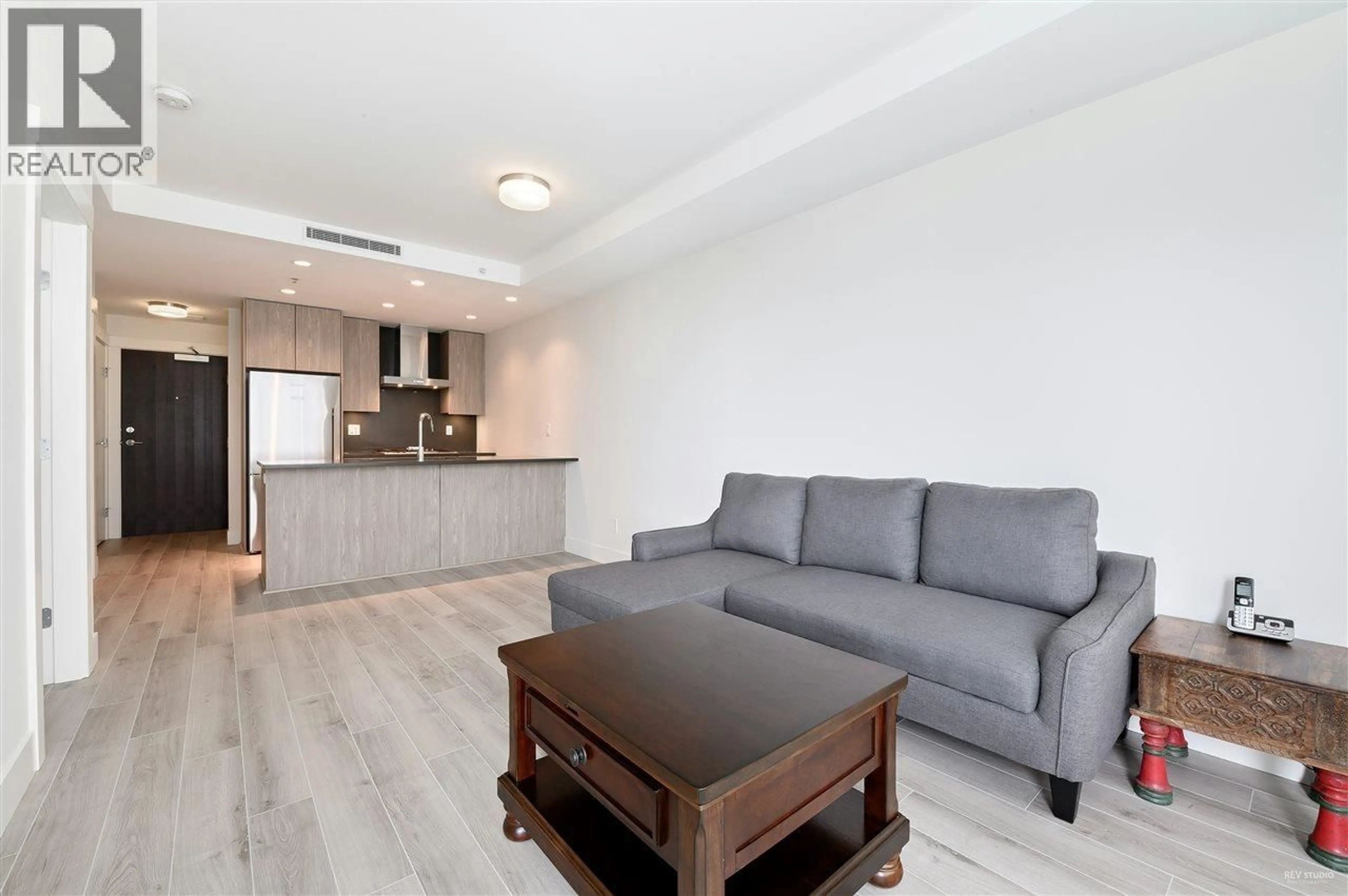 Living room with furniture, wood/laminate floor for 208 - 10780 NO. 5 ROAD, Richmond British Columbia V6W0B8
