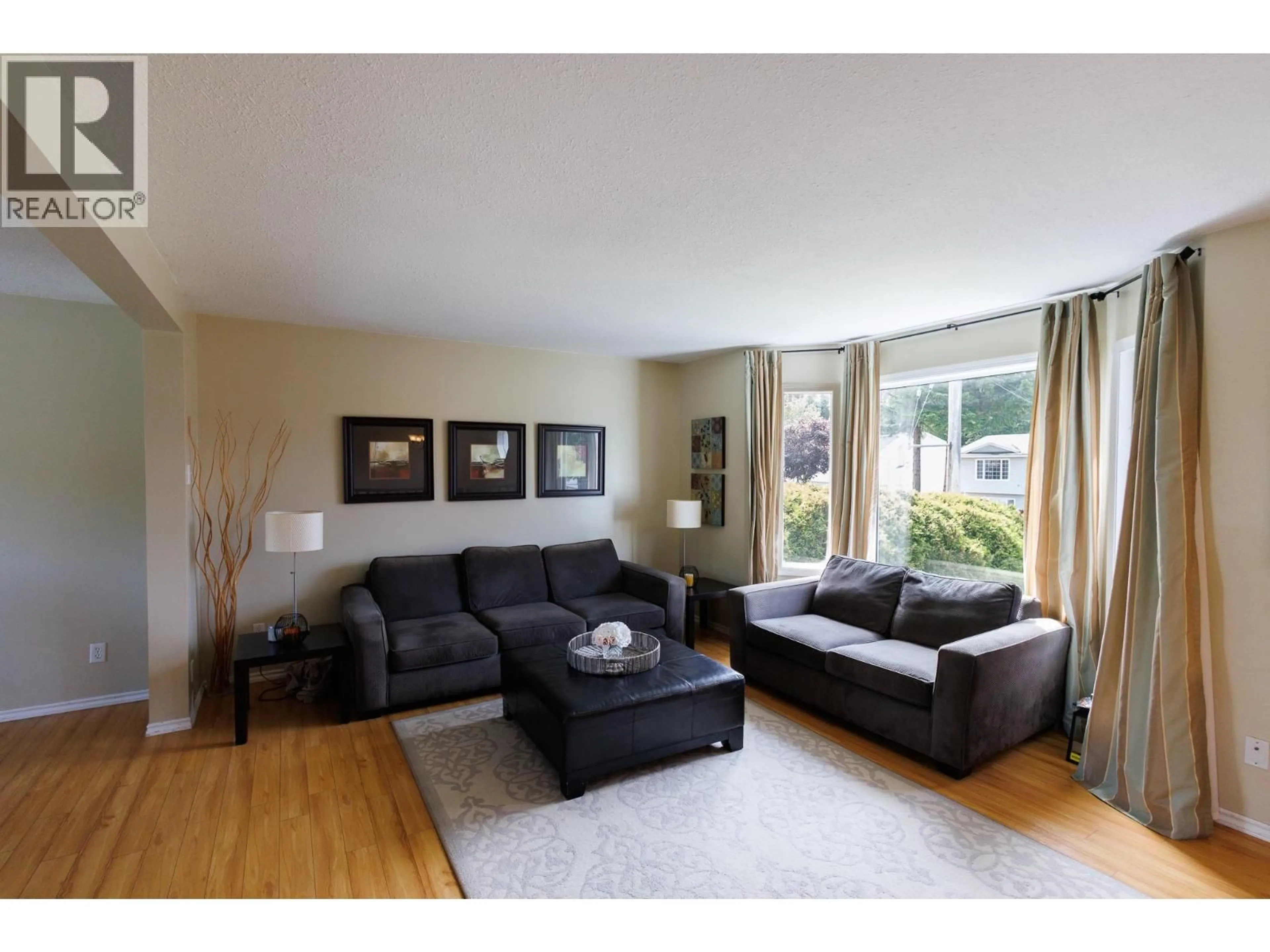Living room with furniture, wood/laminate floor for 3660 BALSAM AVENUE, Terrace British Columbia V8F5E4