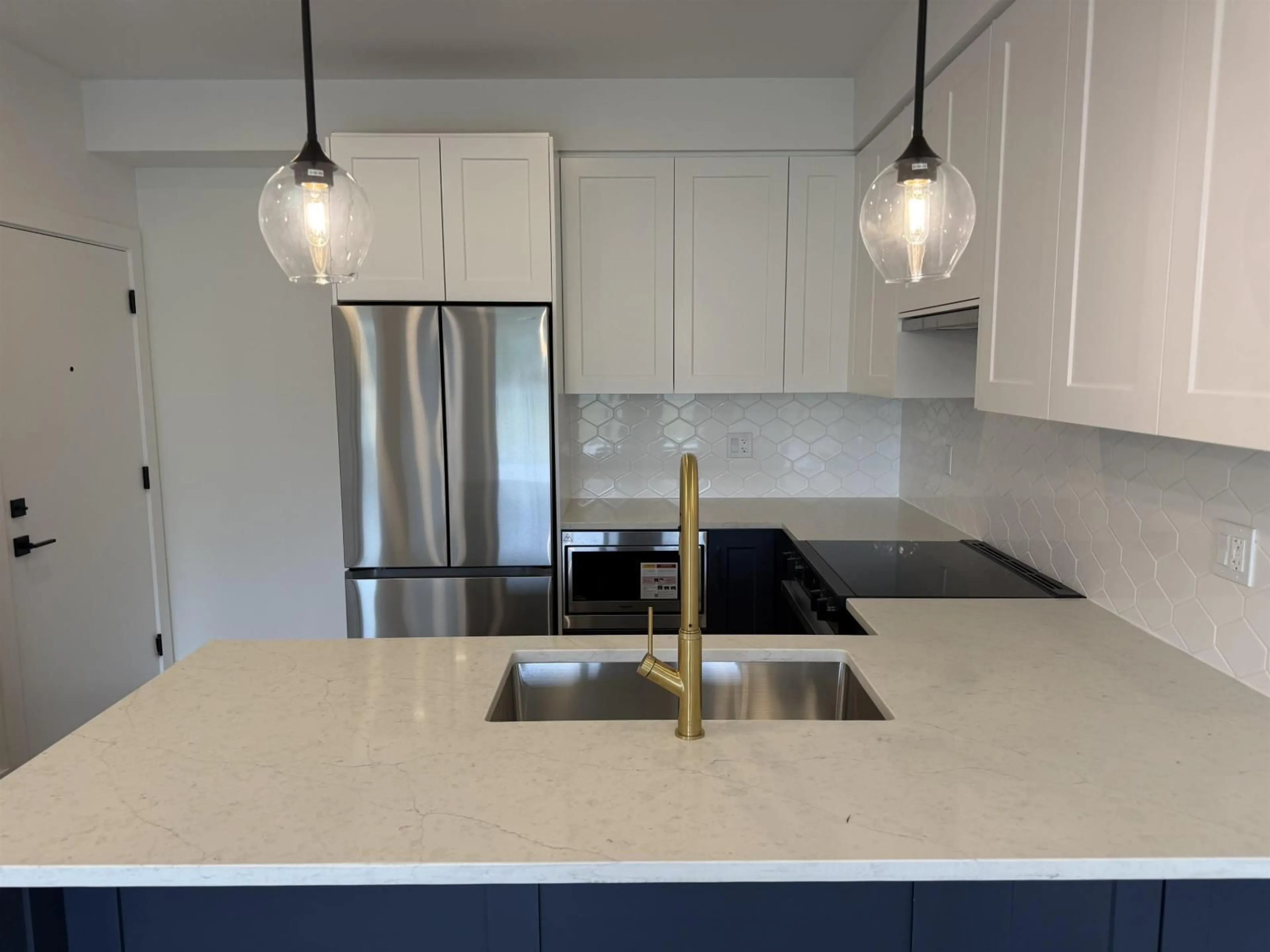 Open concept kitchen, unknown for 202 - 17783 56A AVENUE, Surrey British Columbia V3S1G4