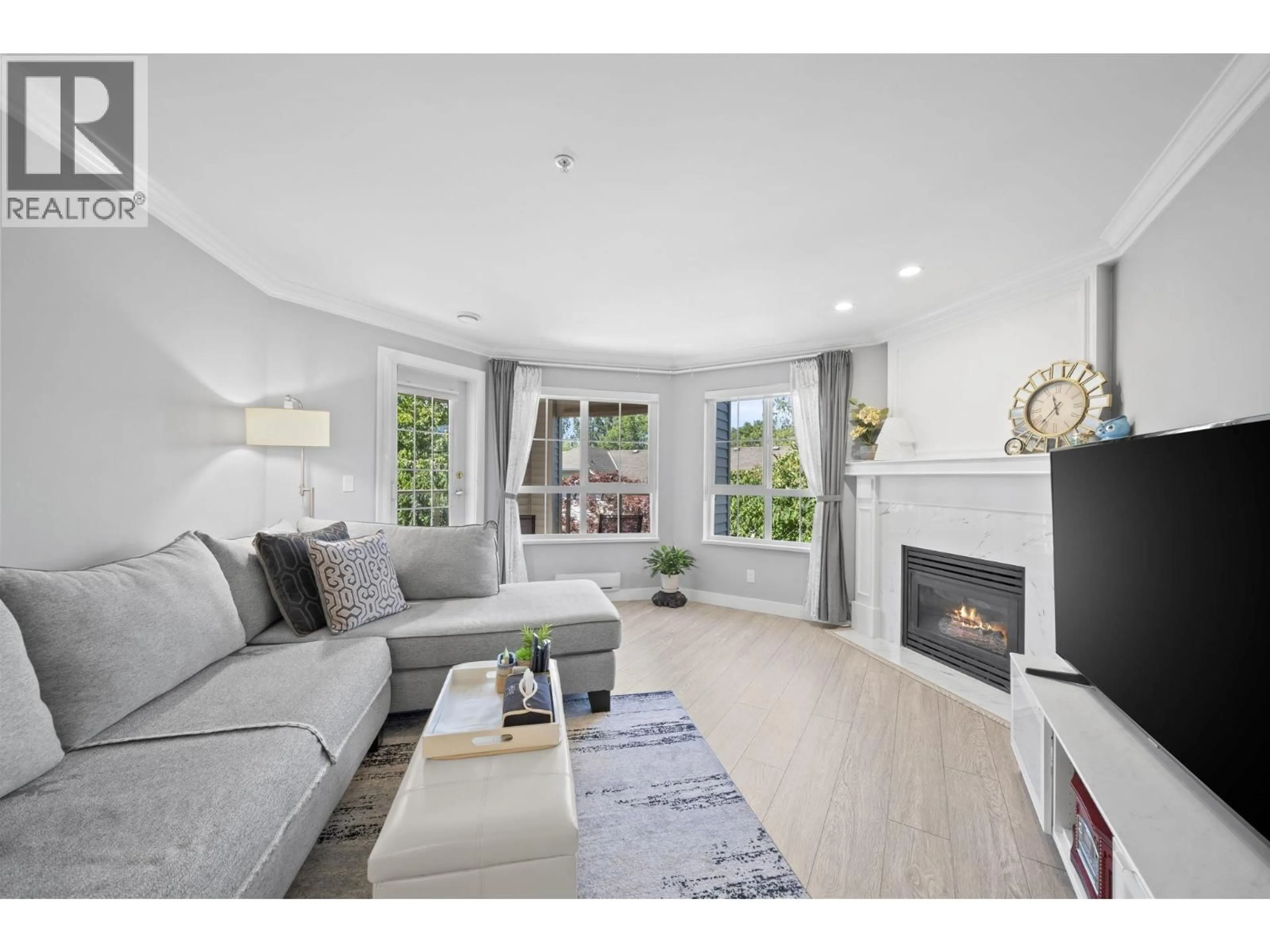 Living room with furniture, wood/laminate floor for 326 - 5500 ANDREWS ROAD, Richmond British Columbia V7E6M9