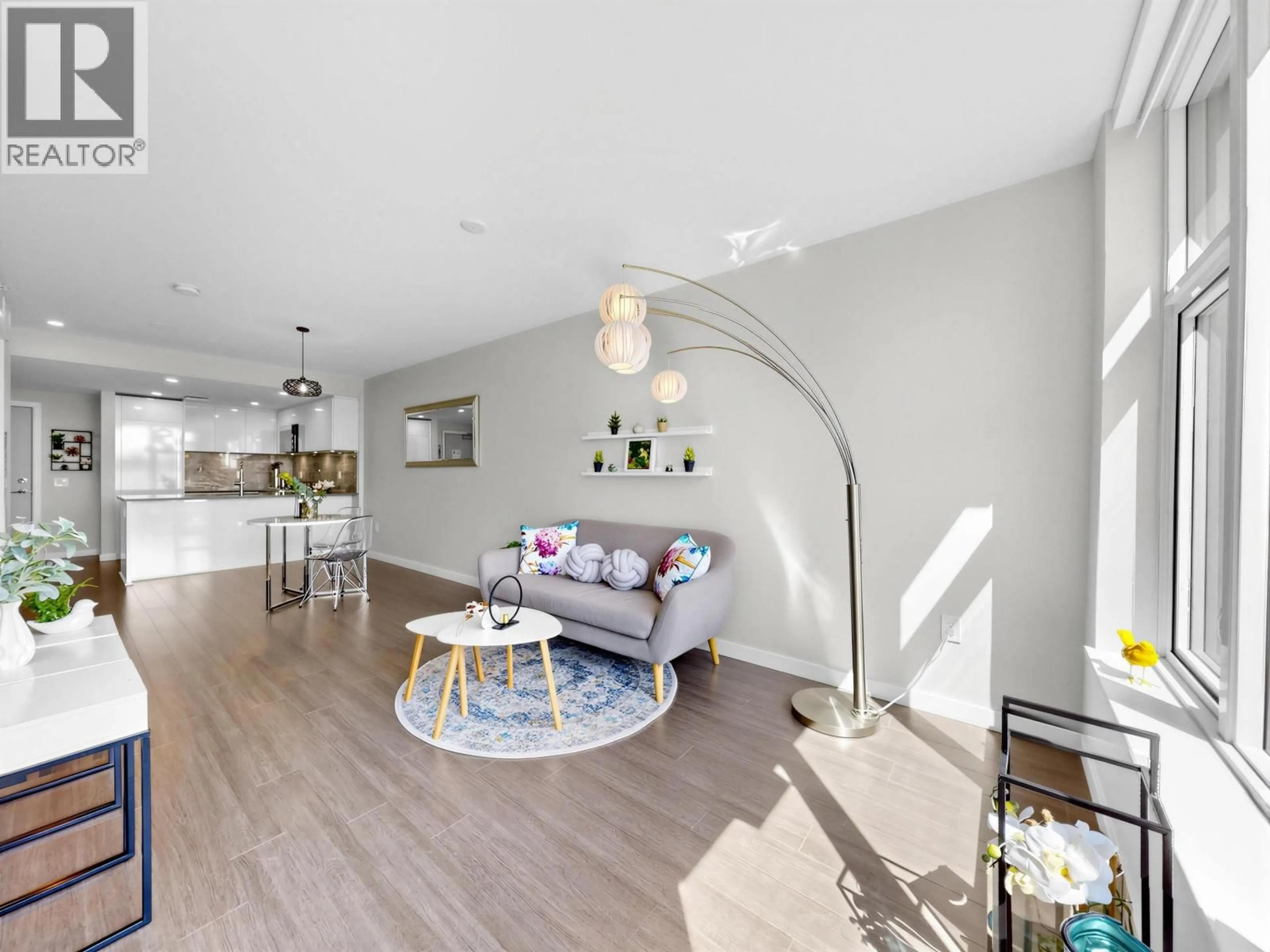 Living room with furniture, unknown for 310 - 3699 SEXSMITH ROAD, Richmond British Columbia V6X0W4