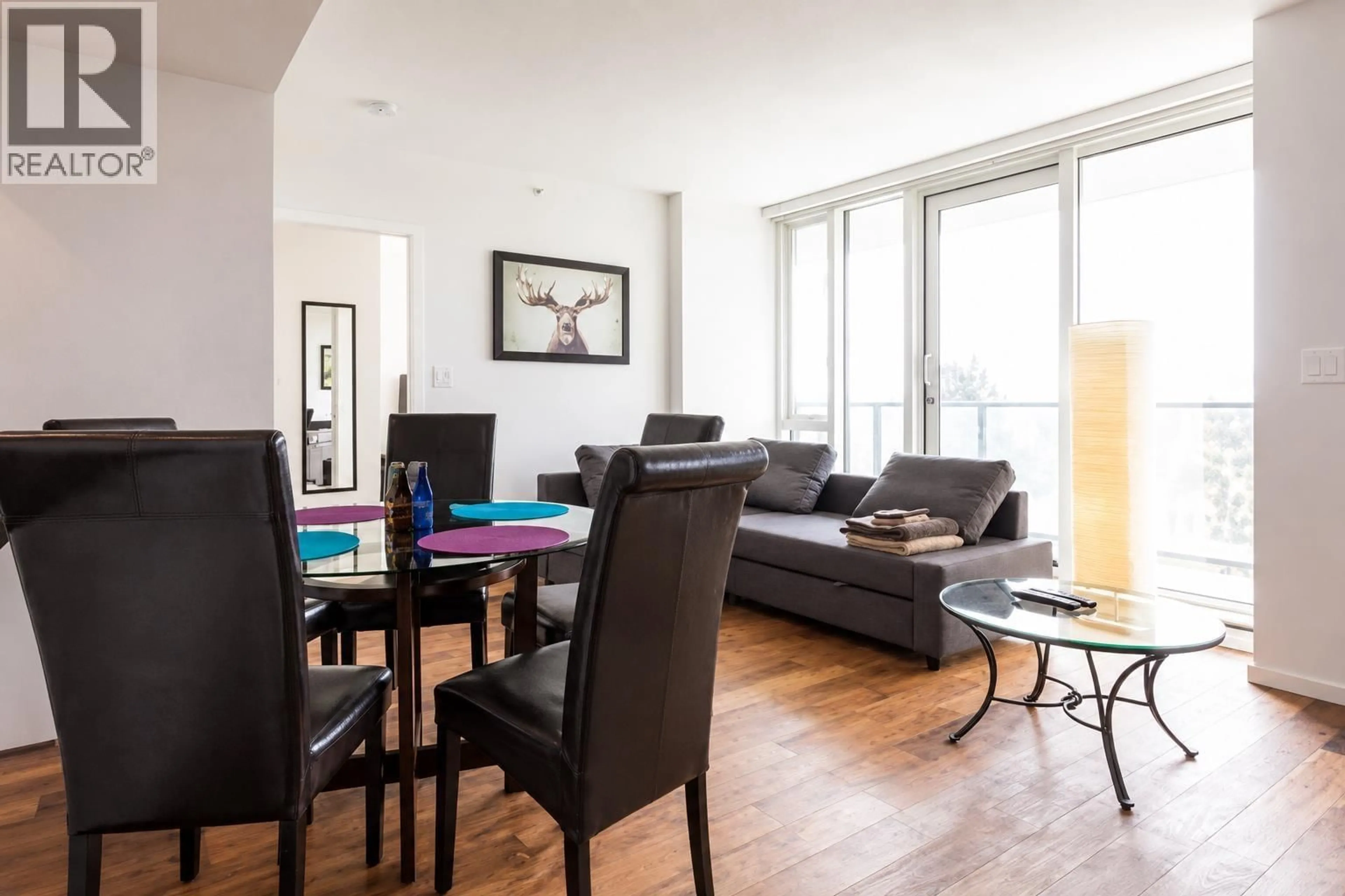 Living room with furniture, wood/laminate floor for 617 - 8488 CORNISH STREET, Vancouver British Columbia V6P0C2