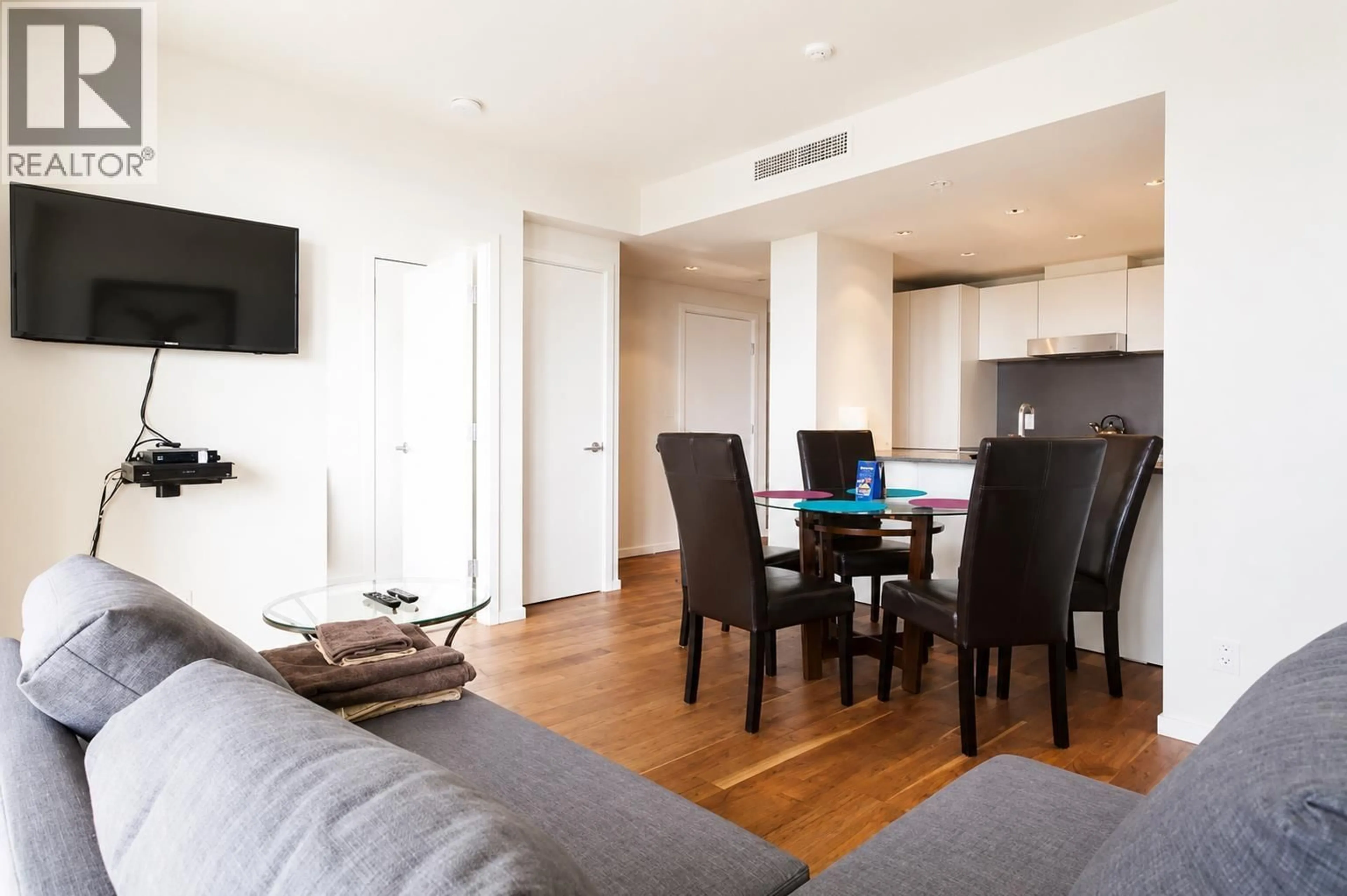 Living room with furniture, wood/laminate floor for 617 - 8488 CORNISH STREET, Vancouver British Columbia V6P0C2