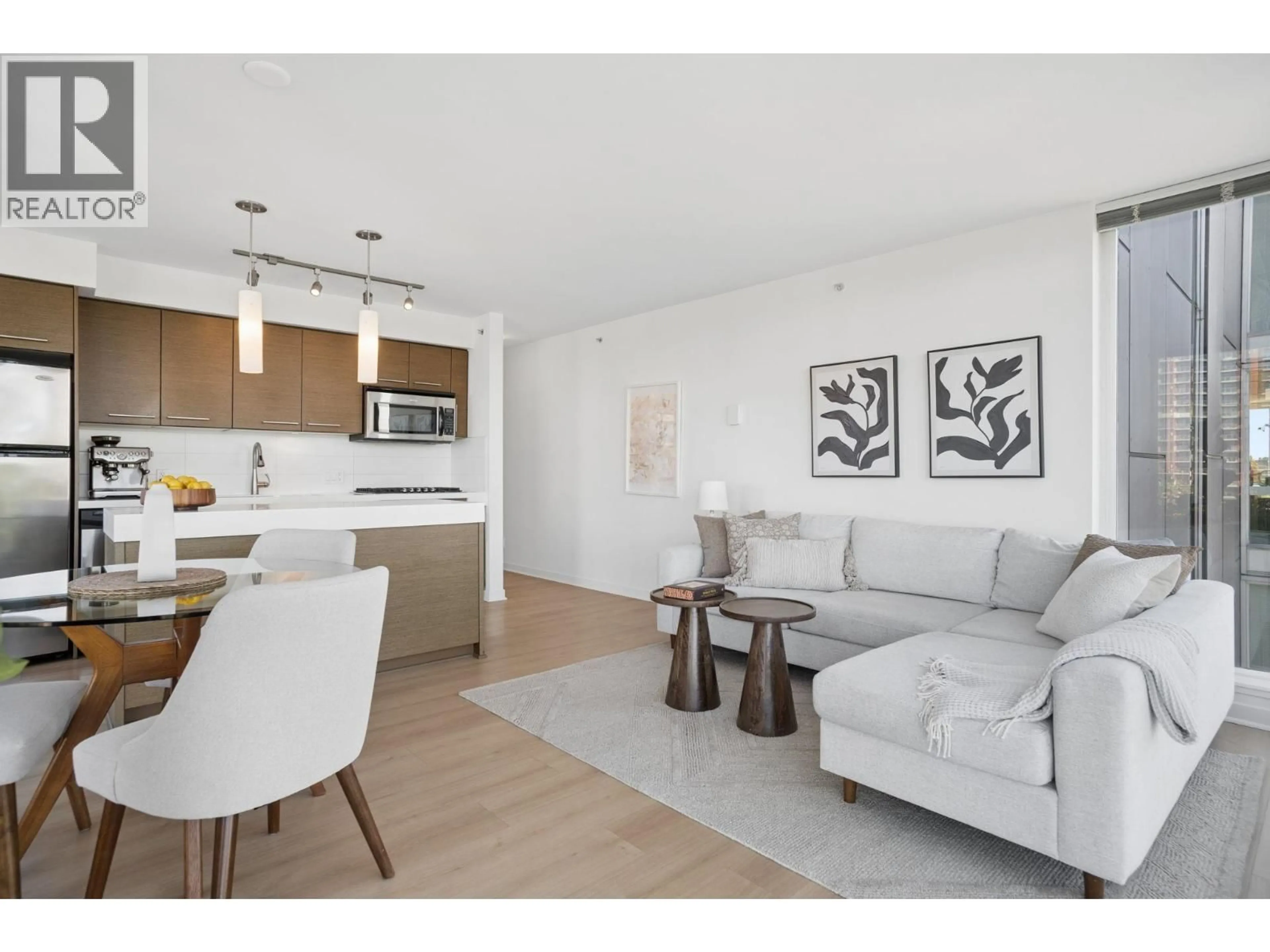 Living room with furniture, wood/laminate floor for 501 - 2770 SOPHIA STREET, Vancouver British Columbia V5T0A4