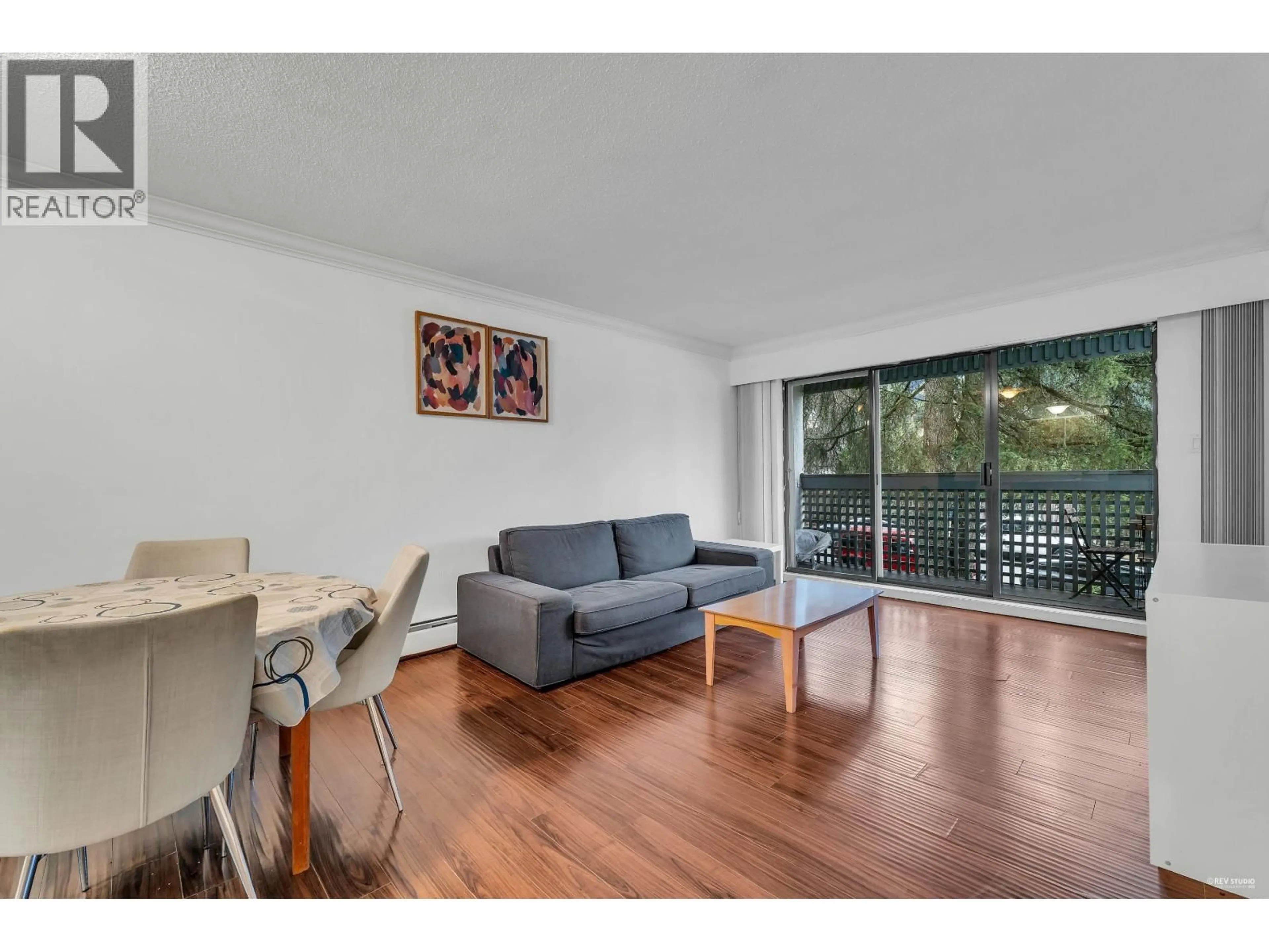 Living room with furniture, wood/laminate floor for 308 - 601 NORTH ROAD, Coquitlam British Columbia V3J1P1