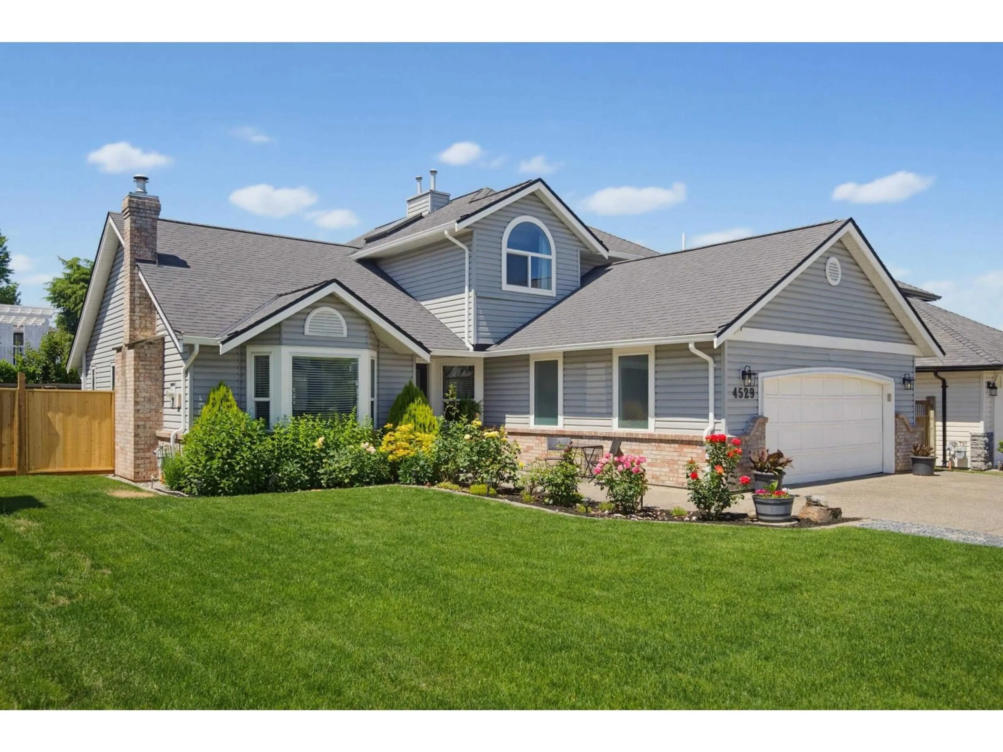 Home with vinyl exterior material, street for 4529 217A STREET, Langley British Columbia V3A8E7