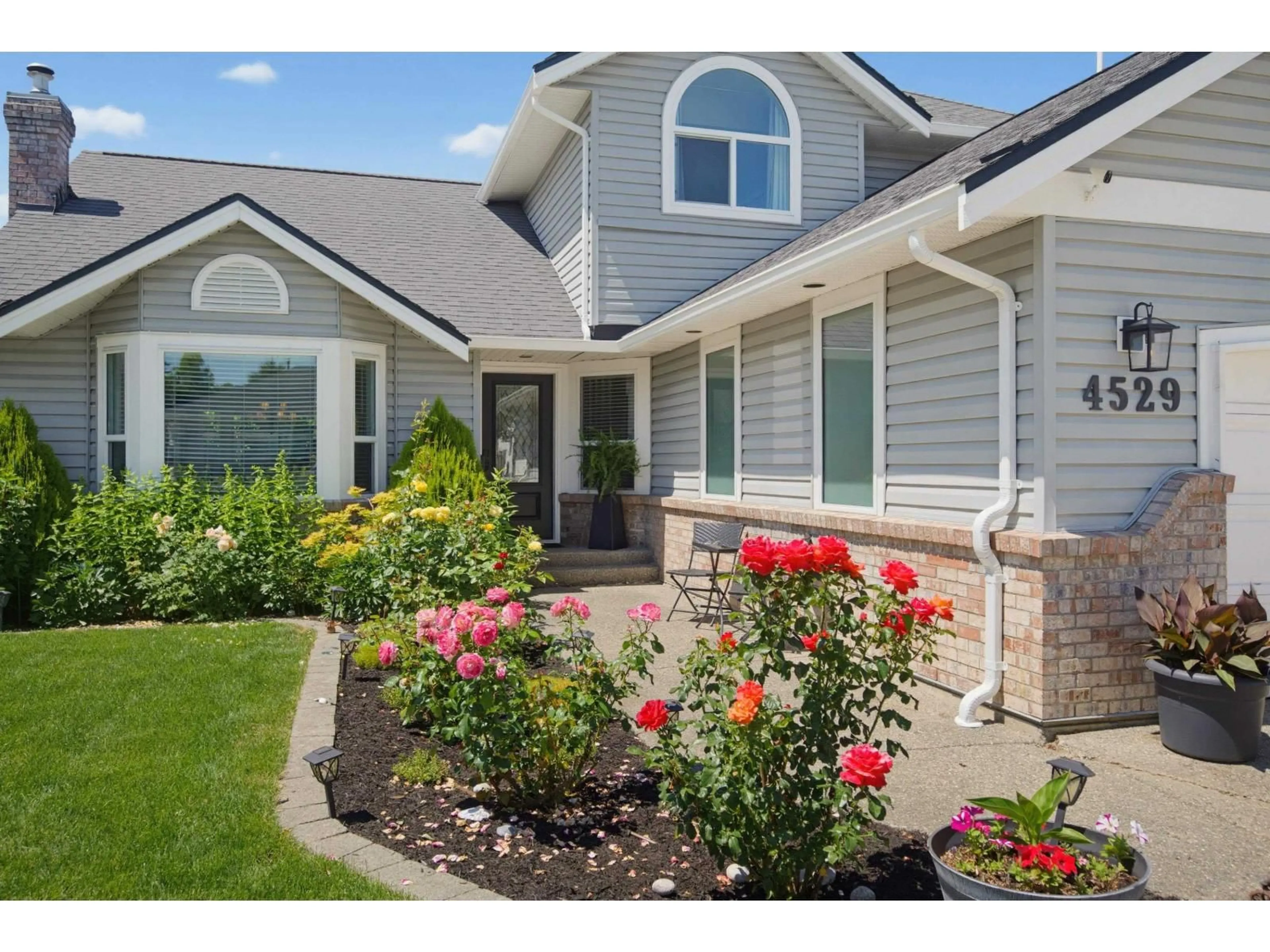 Home with vinyl exterior material, street for 4529 217A STREET, Langley British Columbia V3A8E7